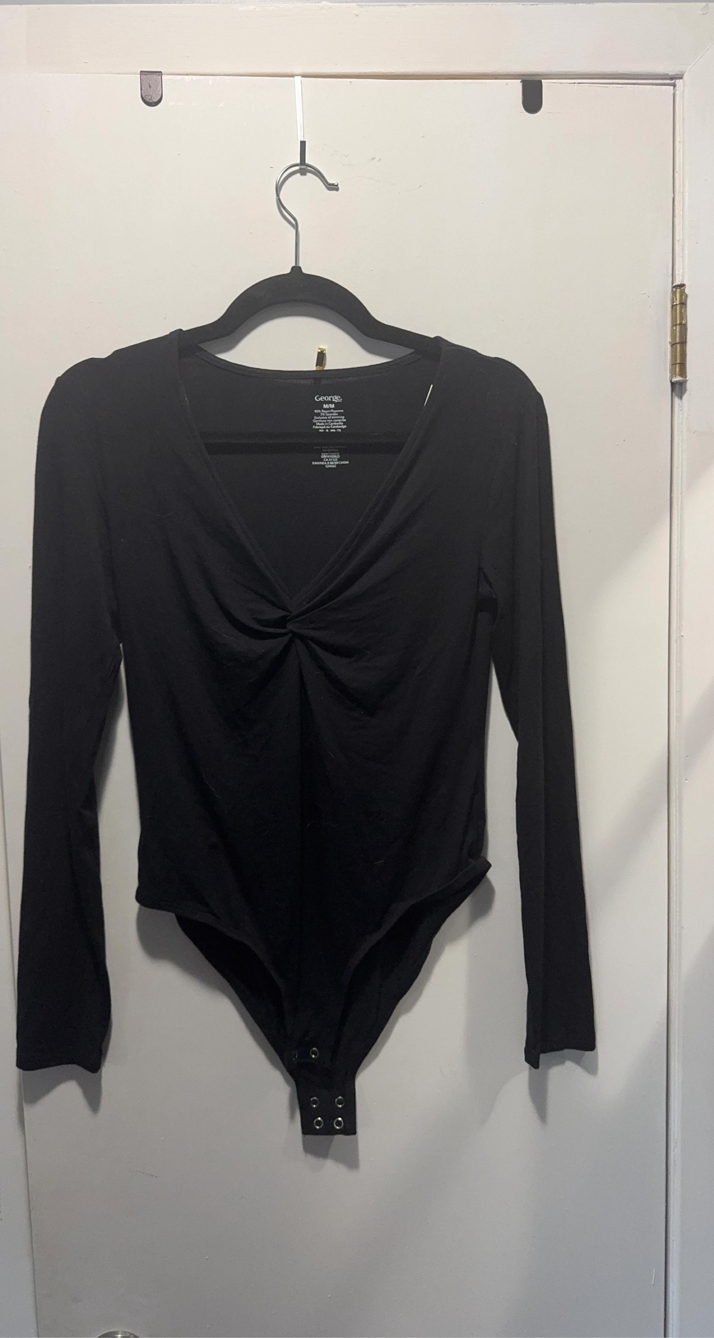 George. Black long sleeve bodysuit