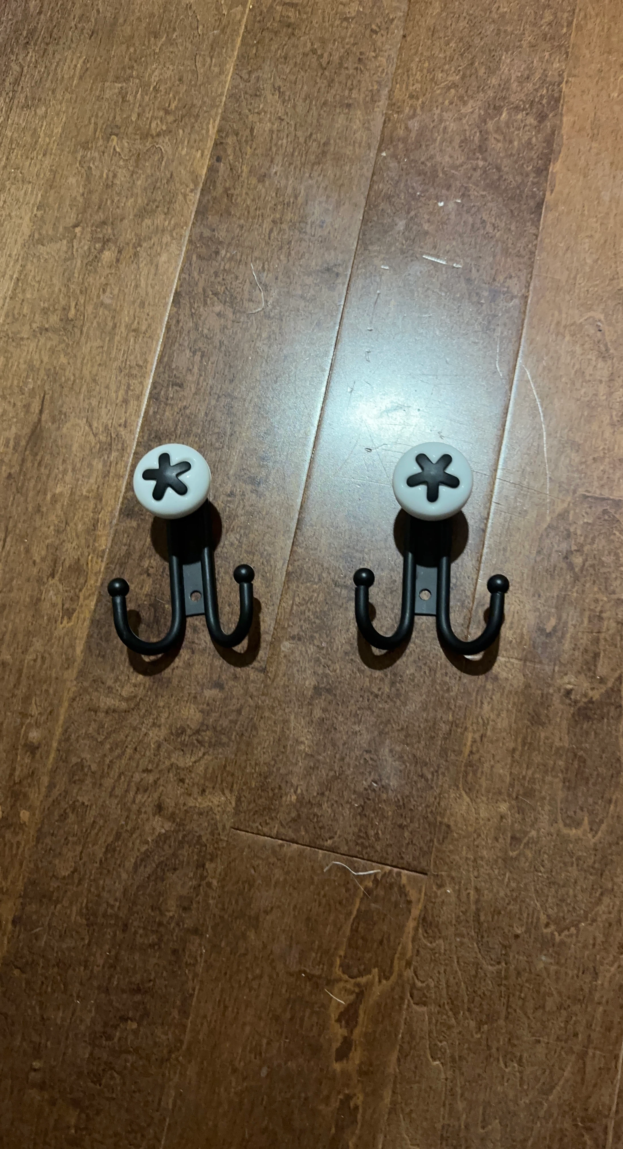 Set of 2 Black Metal Wall Hooks with White Flower Design