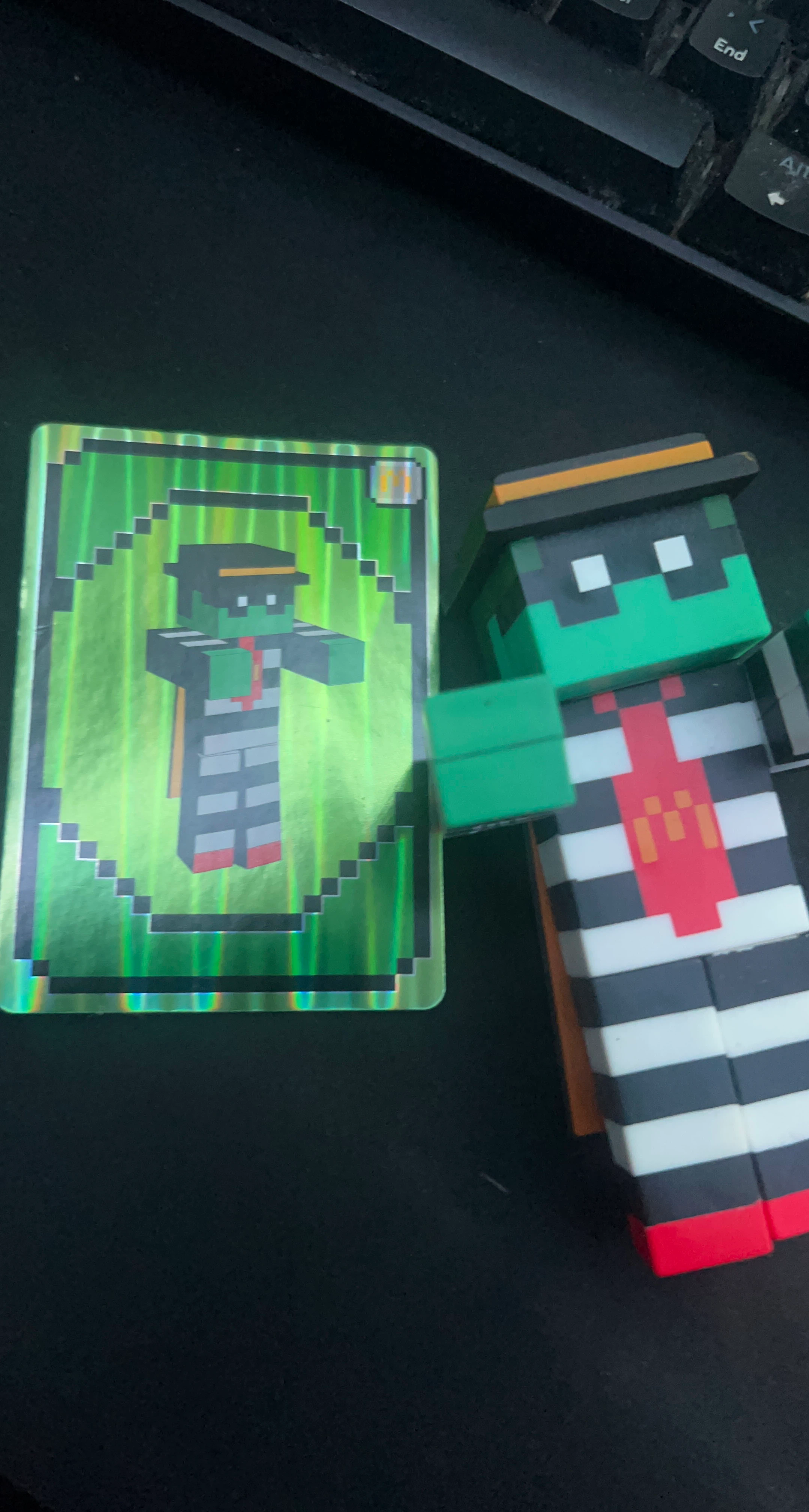 Minecraft-style figure and collectible card