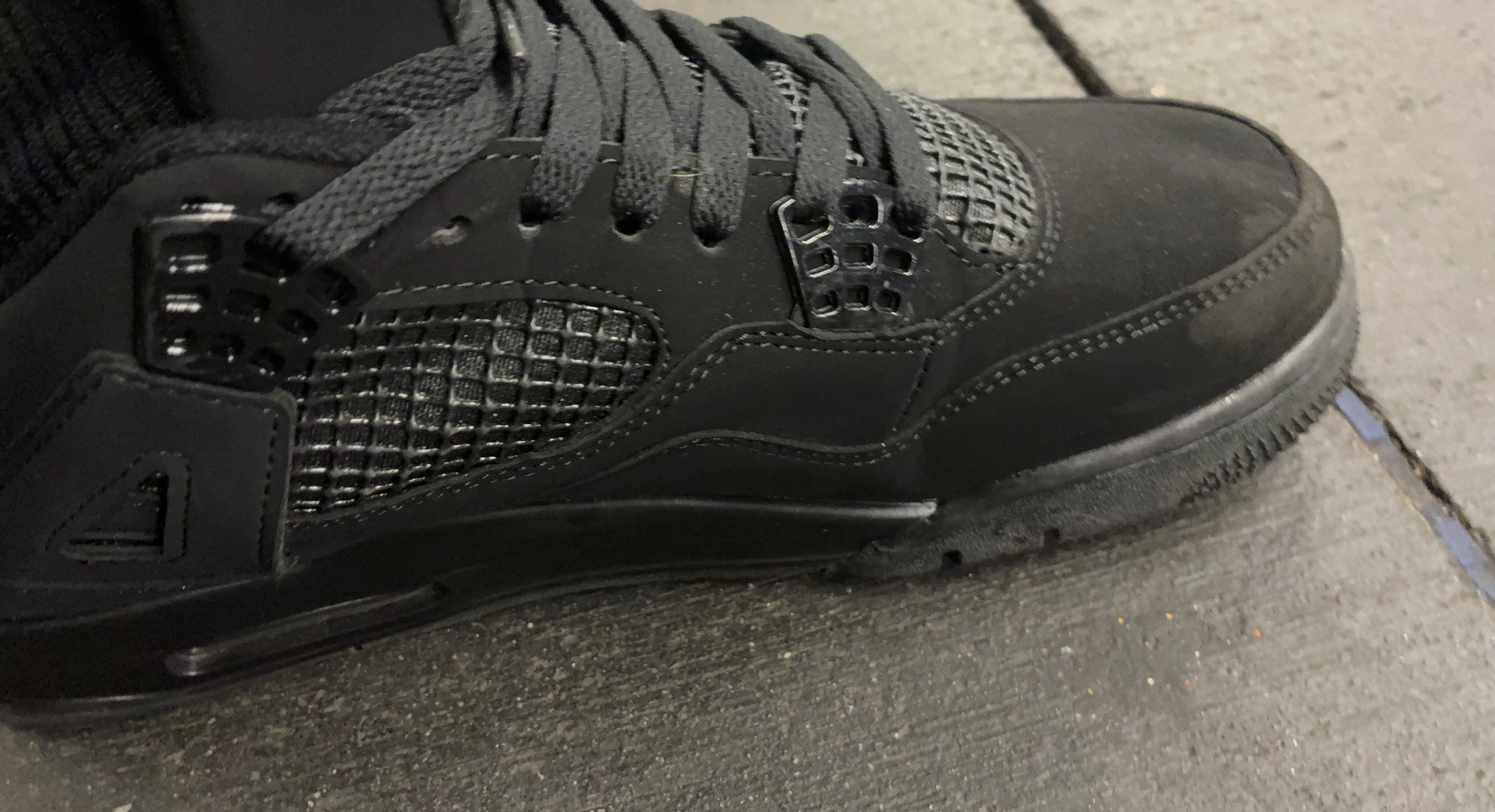 Black Nike Air Jordan 4 Sneakers
