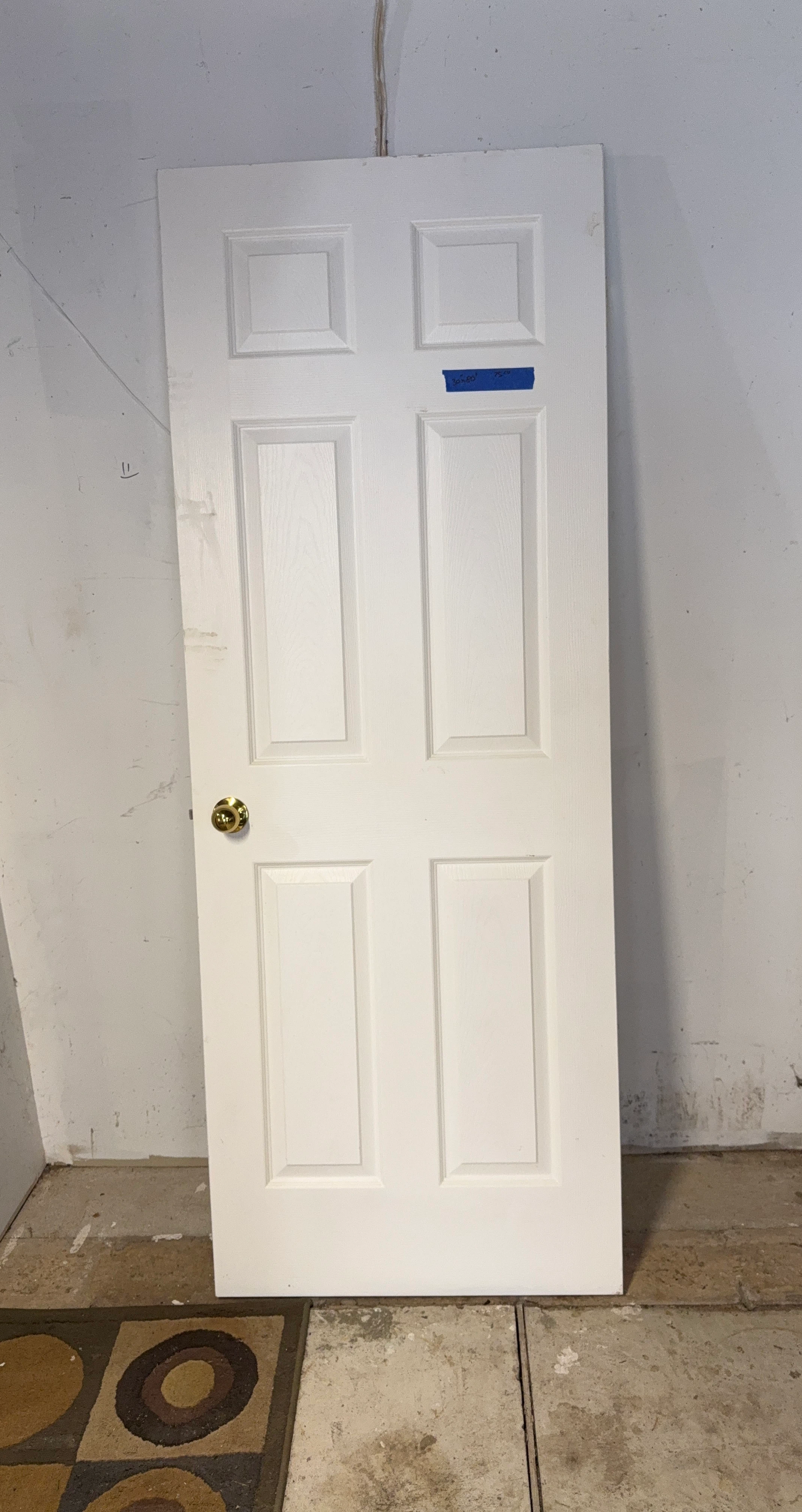 White 6-Panel Interior Door with Brass Doorknob