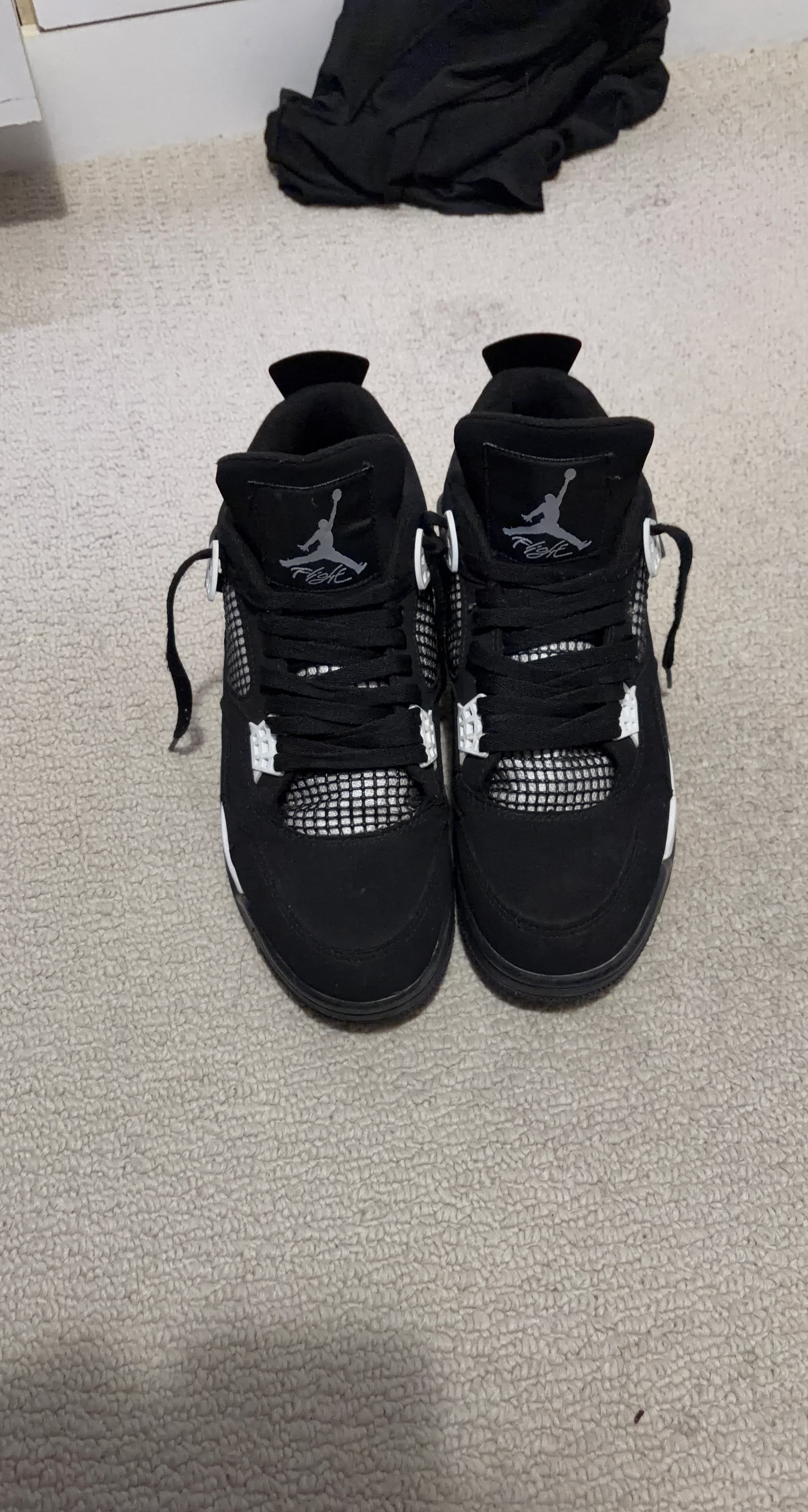 Jordan 4 Black "Flight" Sneakers
