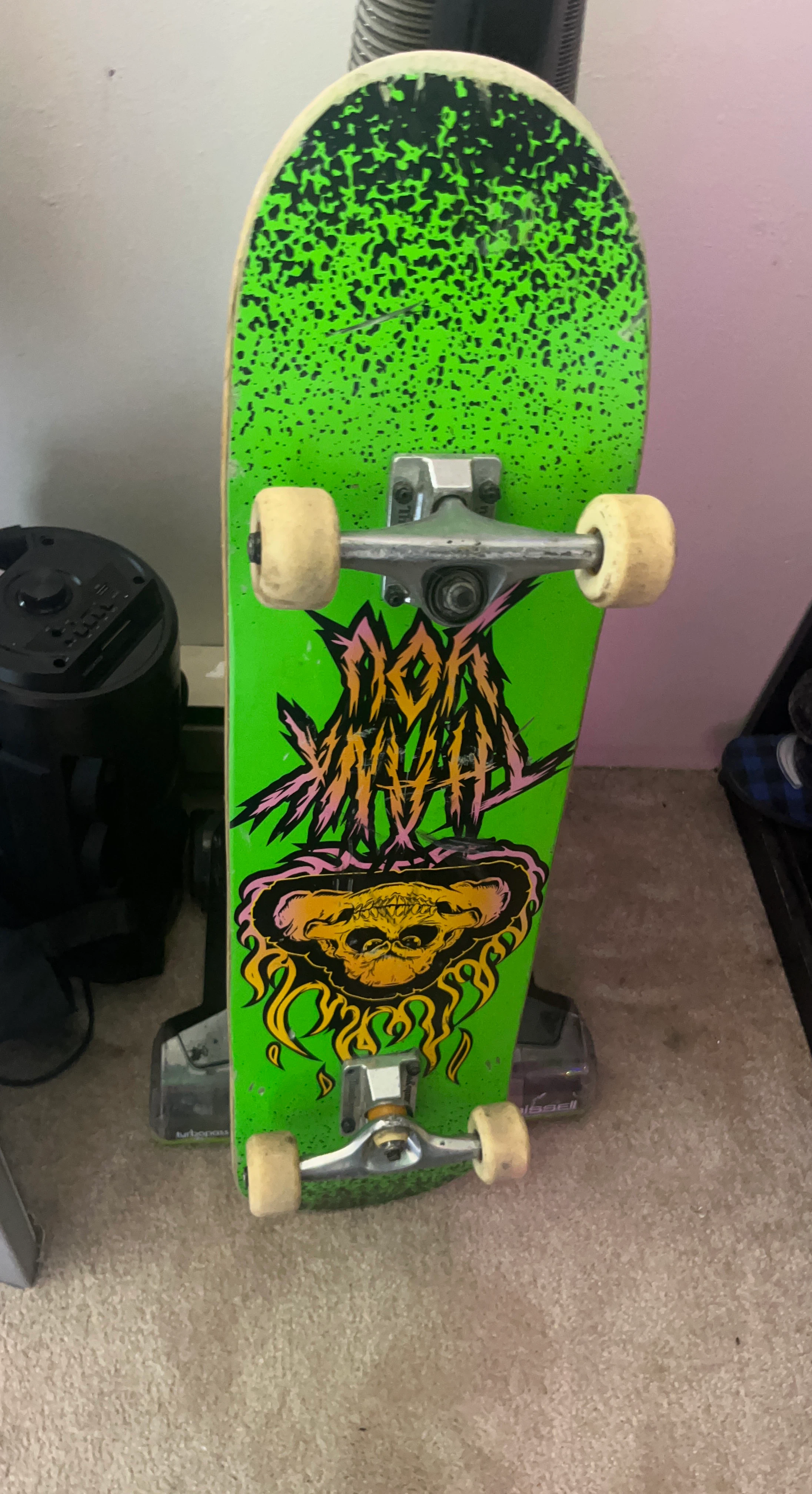 Green Skateboard with Skull Graphic