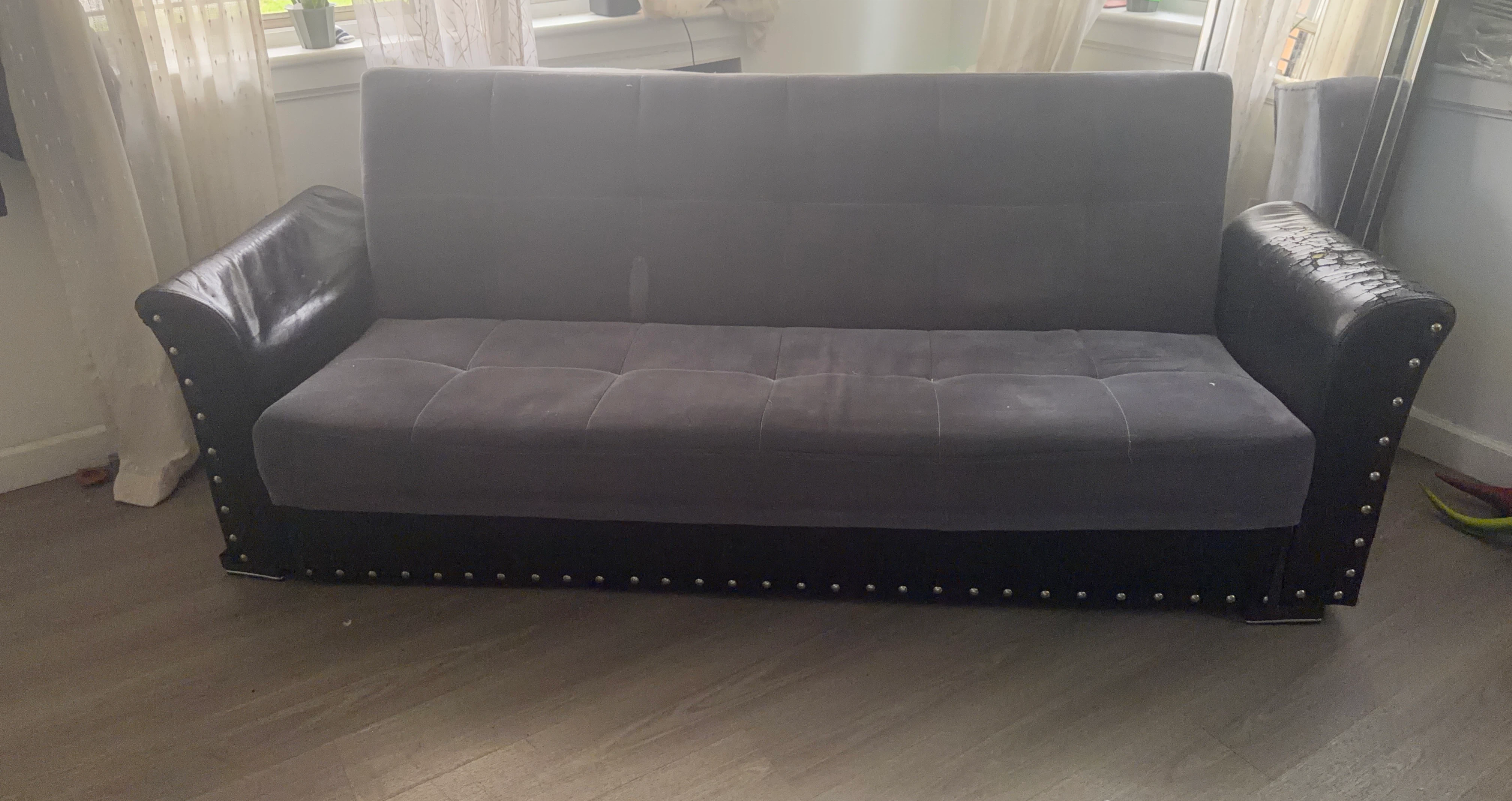 Gray Tufted Sofa with Faux Leather Accents