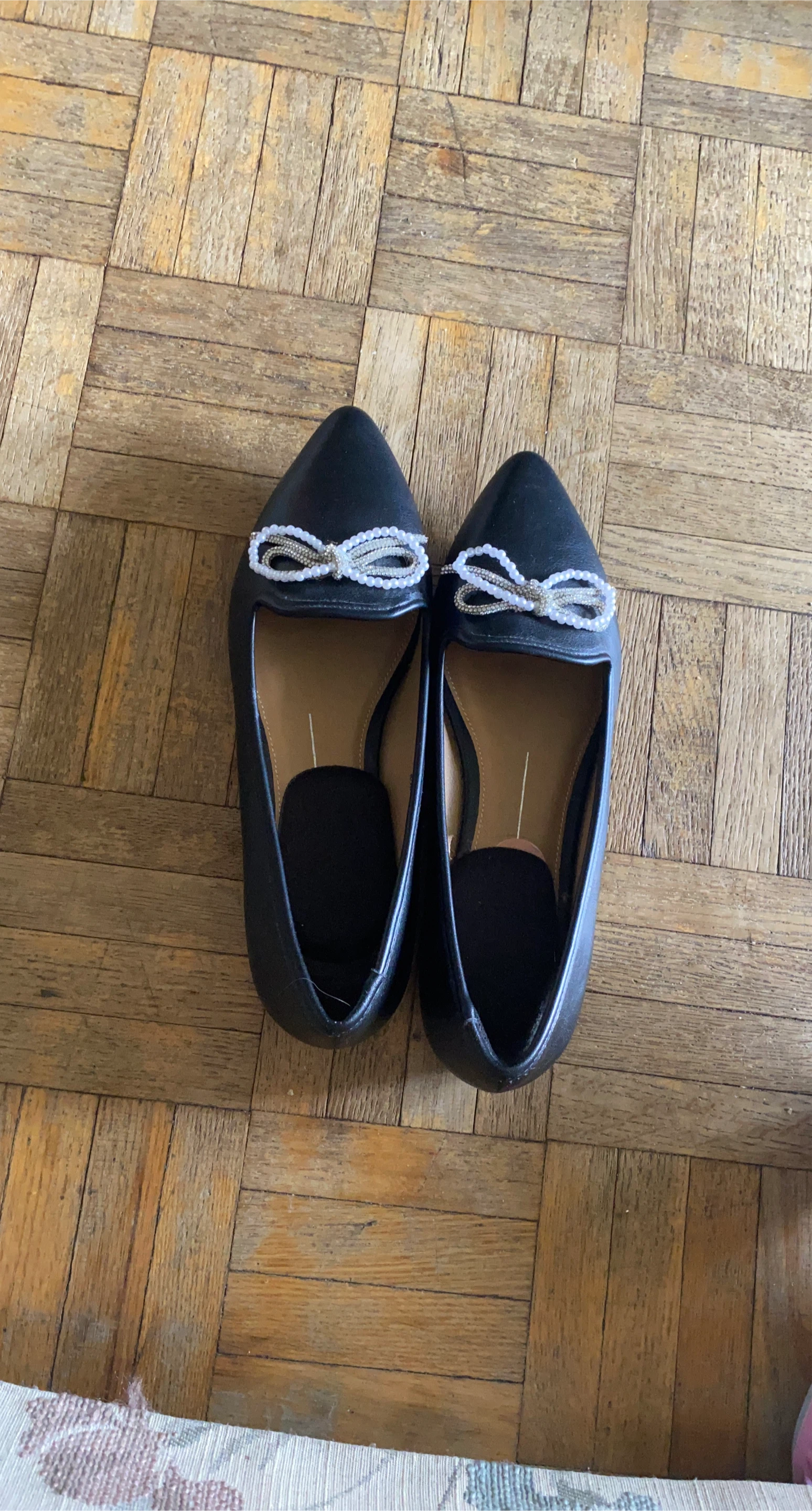 Black loafers with bow detail
