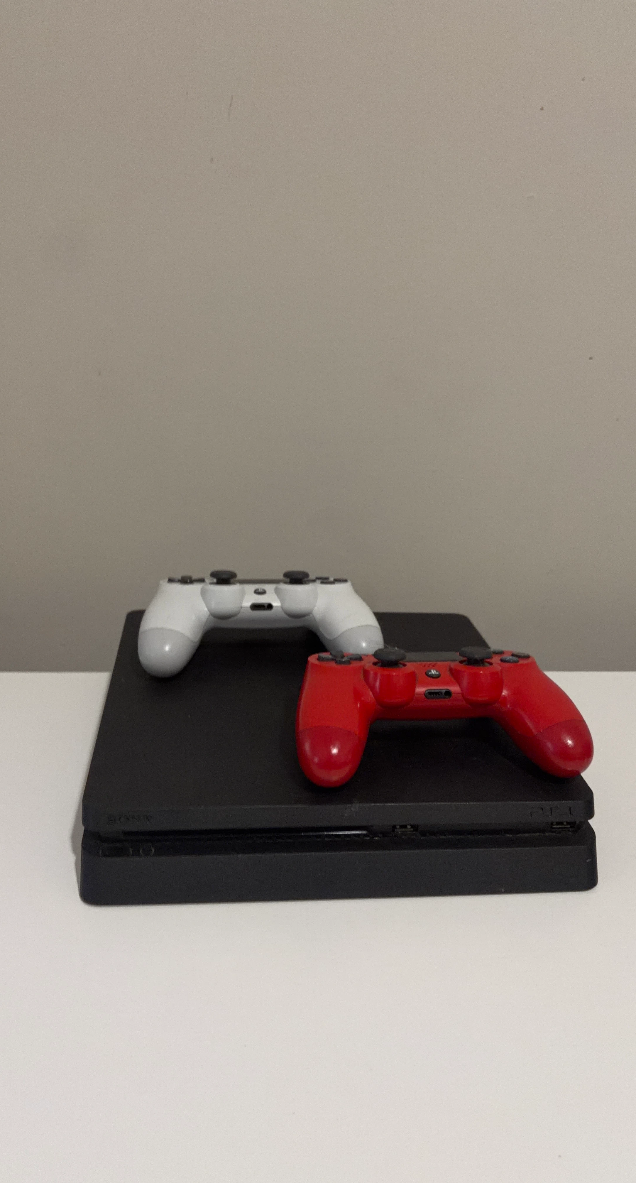 Sony PlayStation 4 Slim Console with 2 Controllers