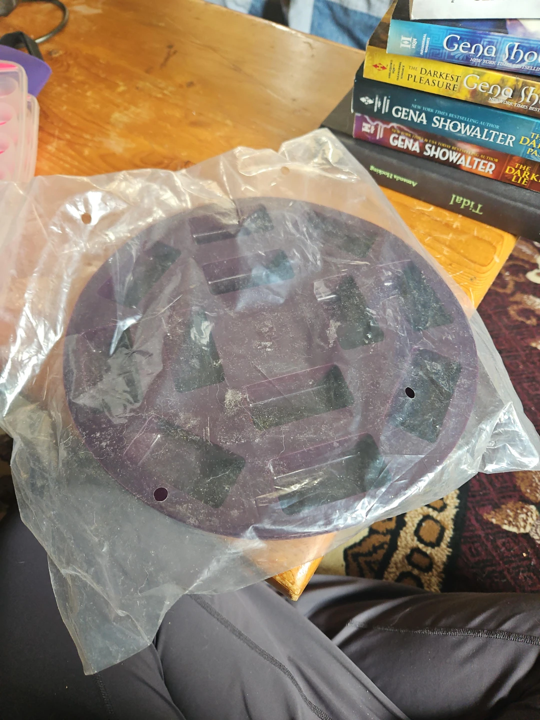Purple plastic round item in packaging