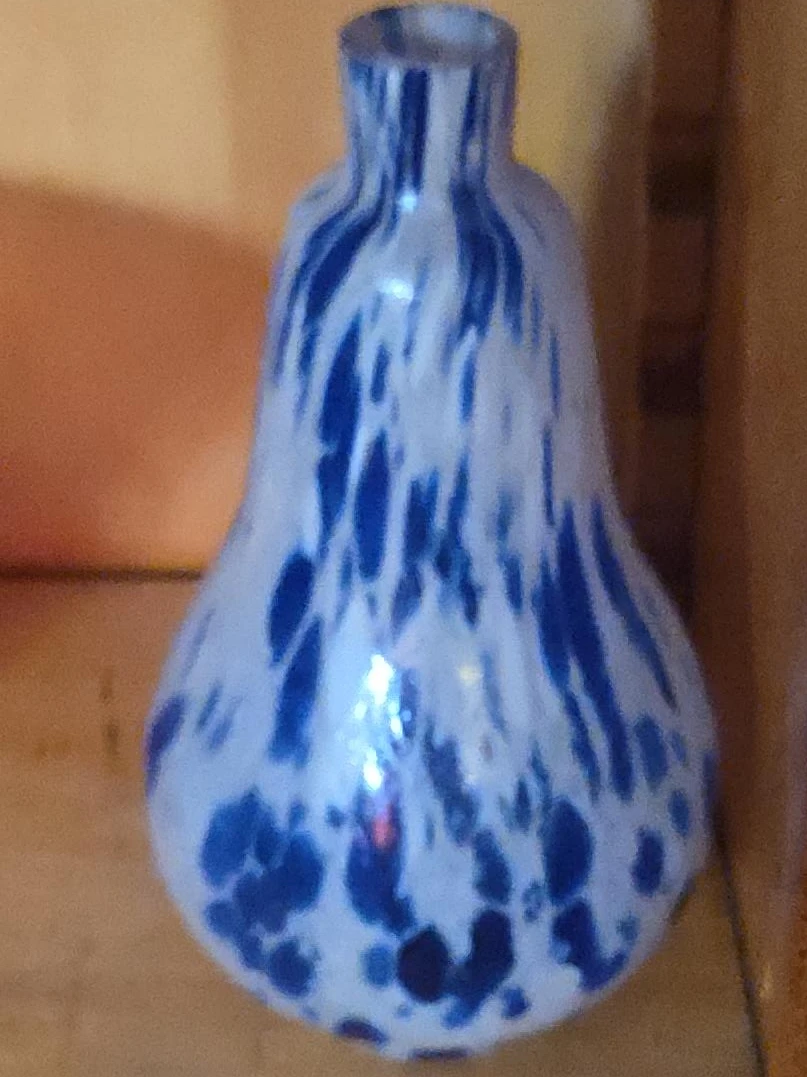 Blue and white speckled glass vase