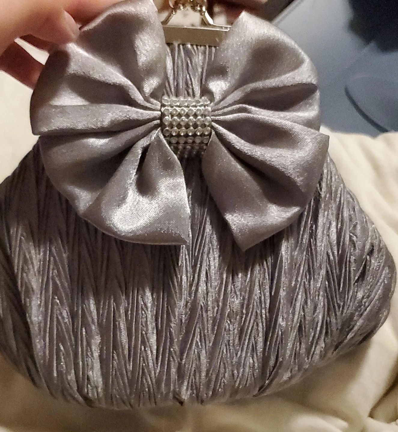 Silver clutch purse with bow