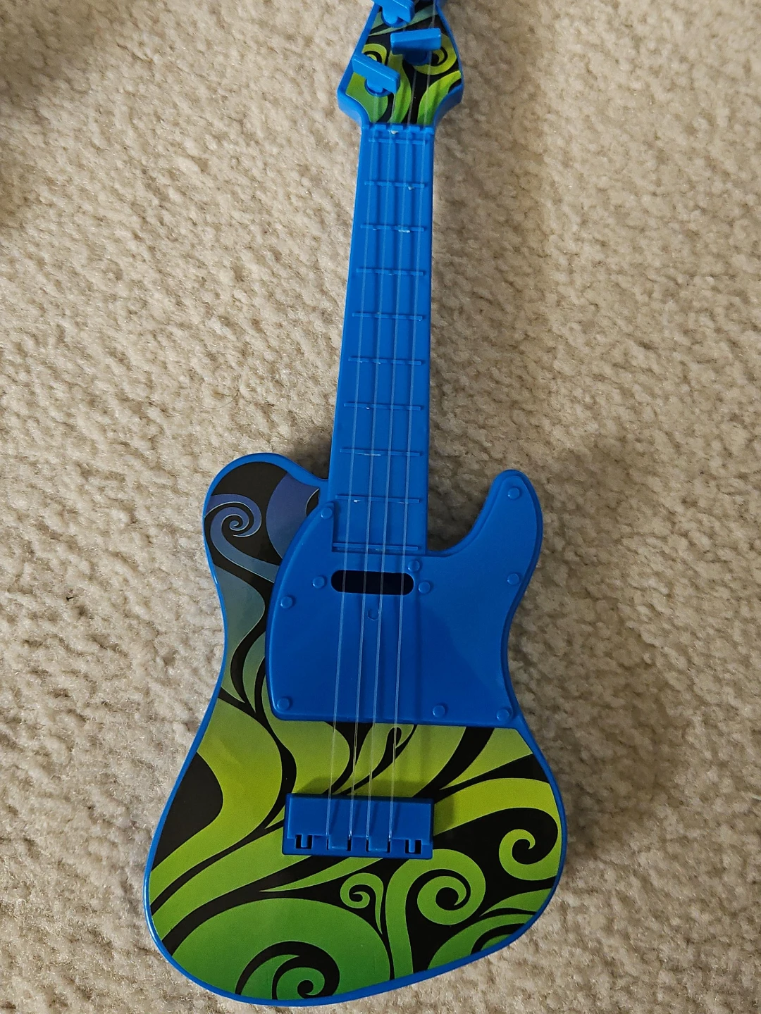 Blue Electric Toy Guitar with Swirl Design