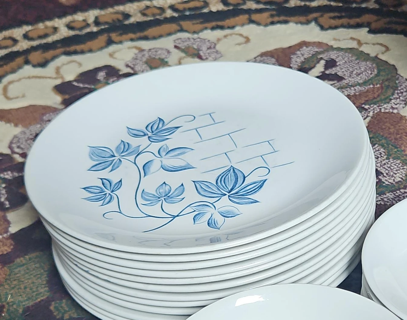 Stack of 12 White Dinner Plates with Blue Floral Design