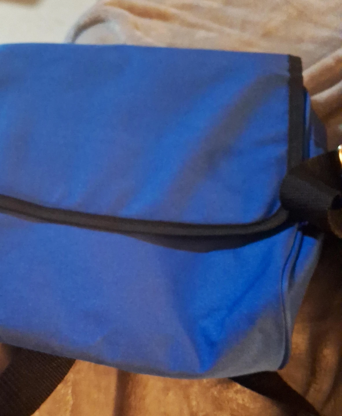 Blue messenger bag with black trim