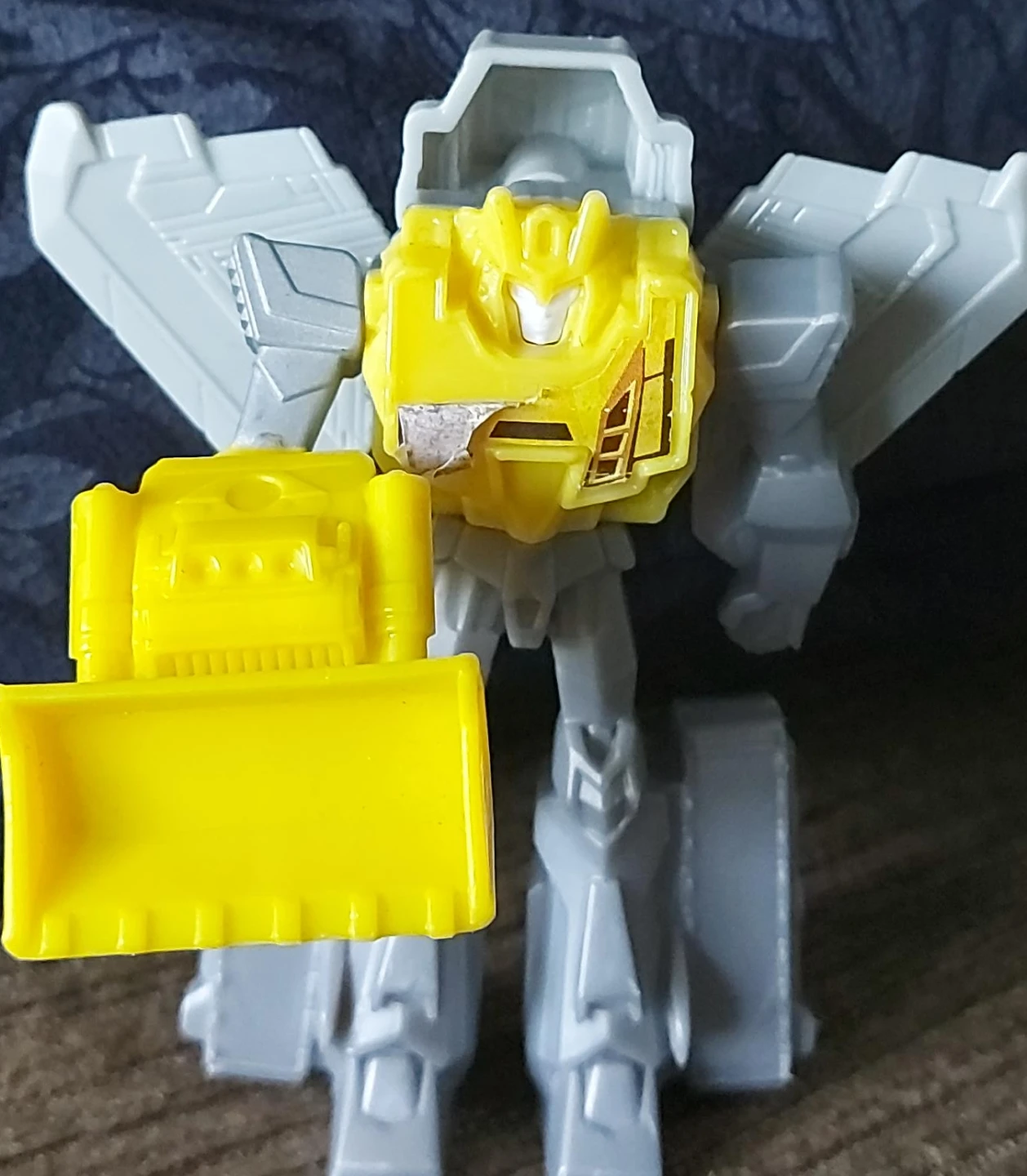 Yellow and Grey Robot Toy with Bulldozer Attachment