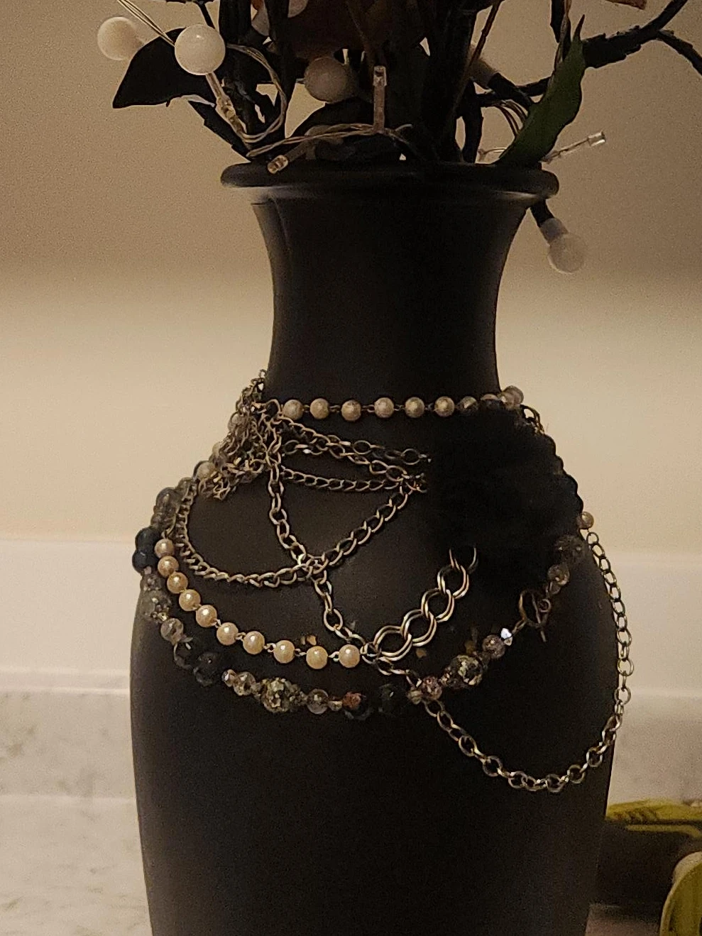 Black Vase with Decorative Chains and Beads