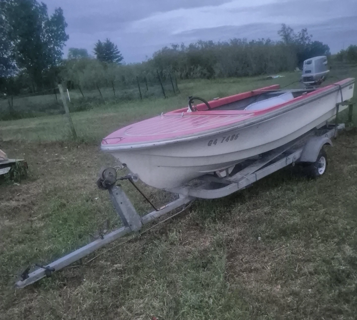 Fiber glass fishing boat with trailer and outboard motor