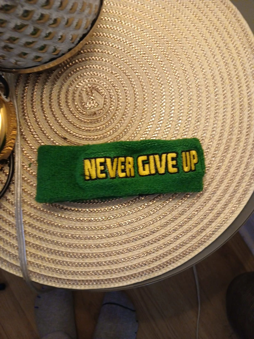 Authentic WWE product"Never Give Up" Sweatband