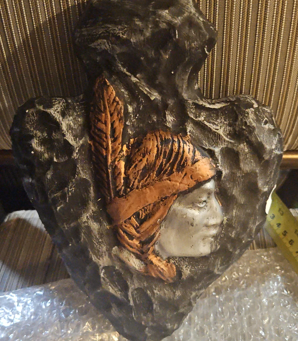 Heart-shaped wall decor with Native American profile