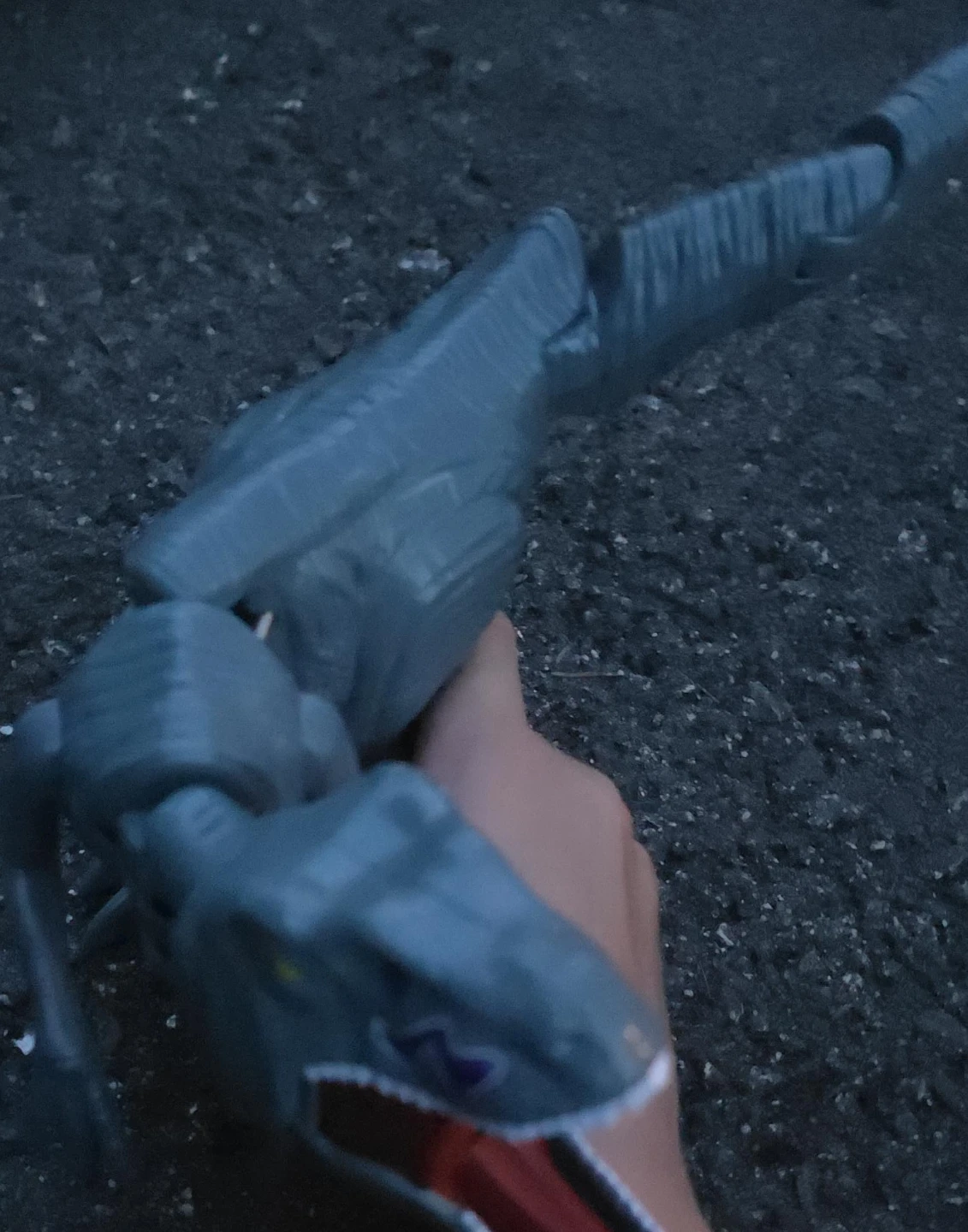 Grey articulated dinosaur toy