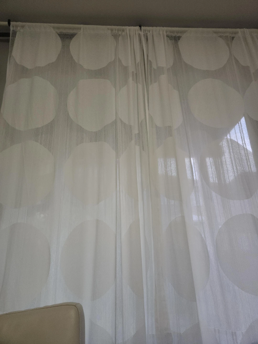 White sheer curtains with circle pattern