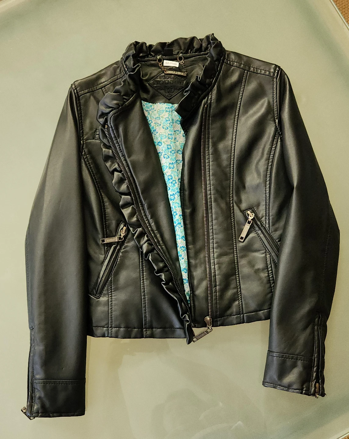 Girls Black Faux Leather Jacket with Ruffle Detail