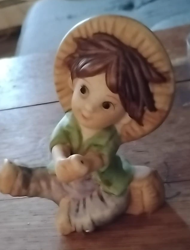 Vintage Ceramic Figurine of a Child with a Hat