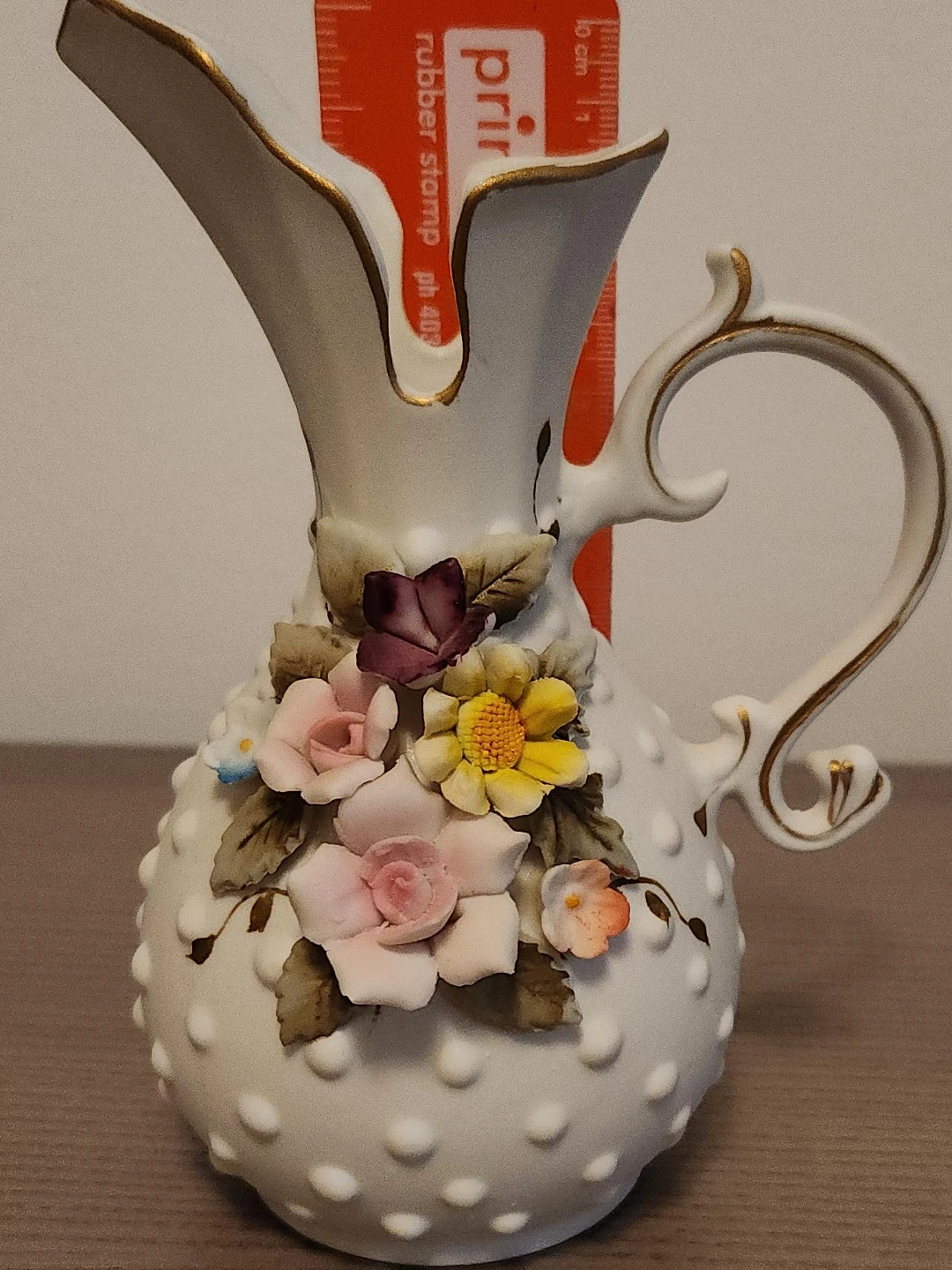 Decorative Ceramic Pitcher with Floral Embellishments