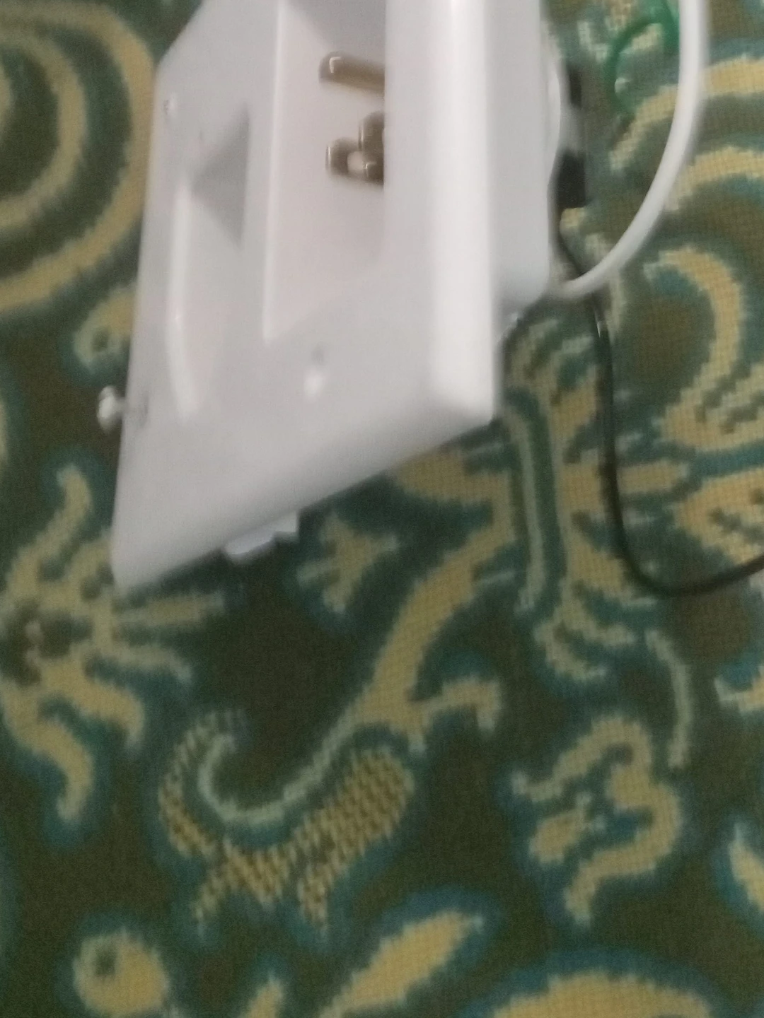 White electrical outlet with plug