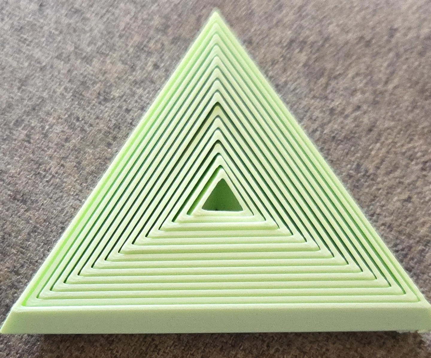 Light green triangle fidget