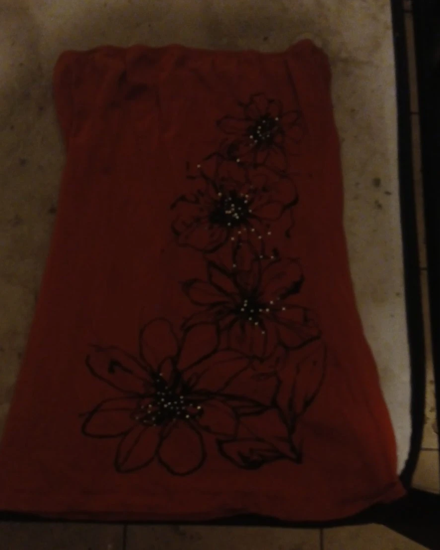 Red strapless top with floral design