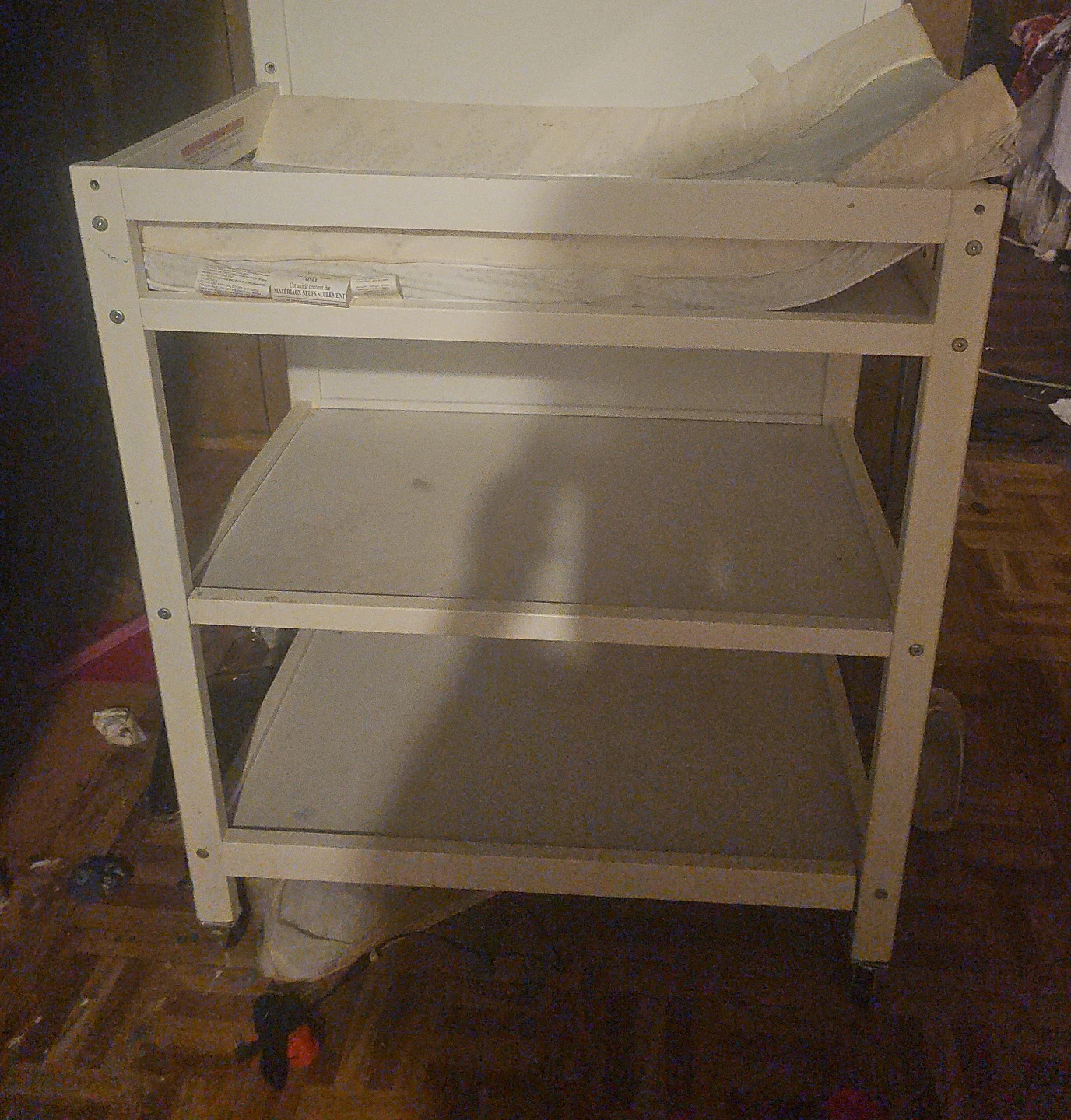 White changing table with shelves