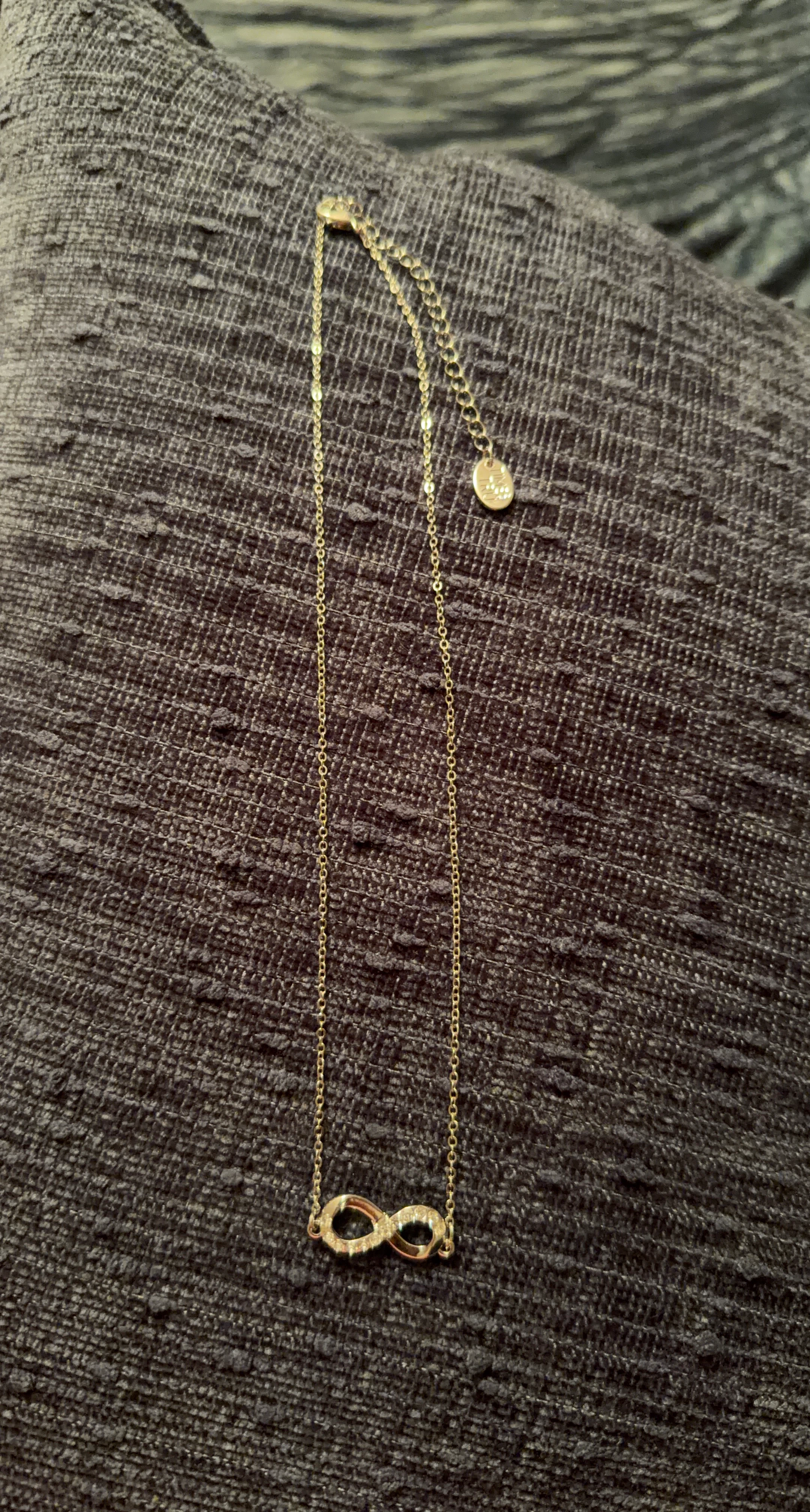 Silver Tone Infinity Necklace with Clear Stones