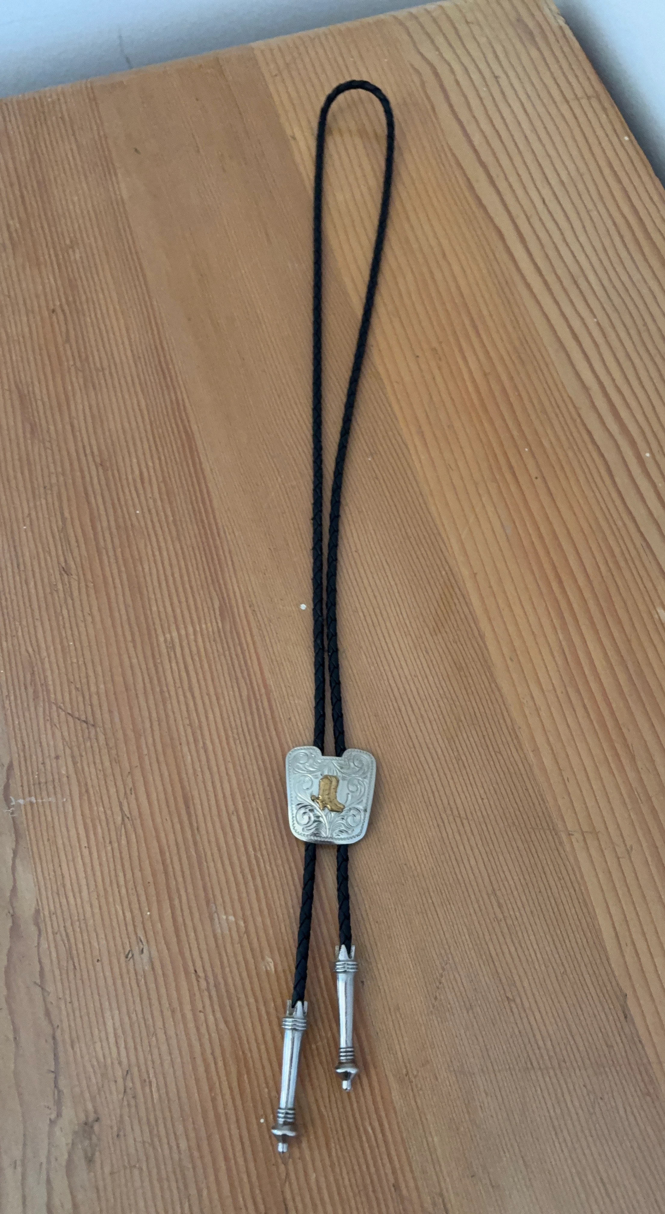 Silver Bolo Tie with Gold Boot Design