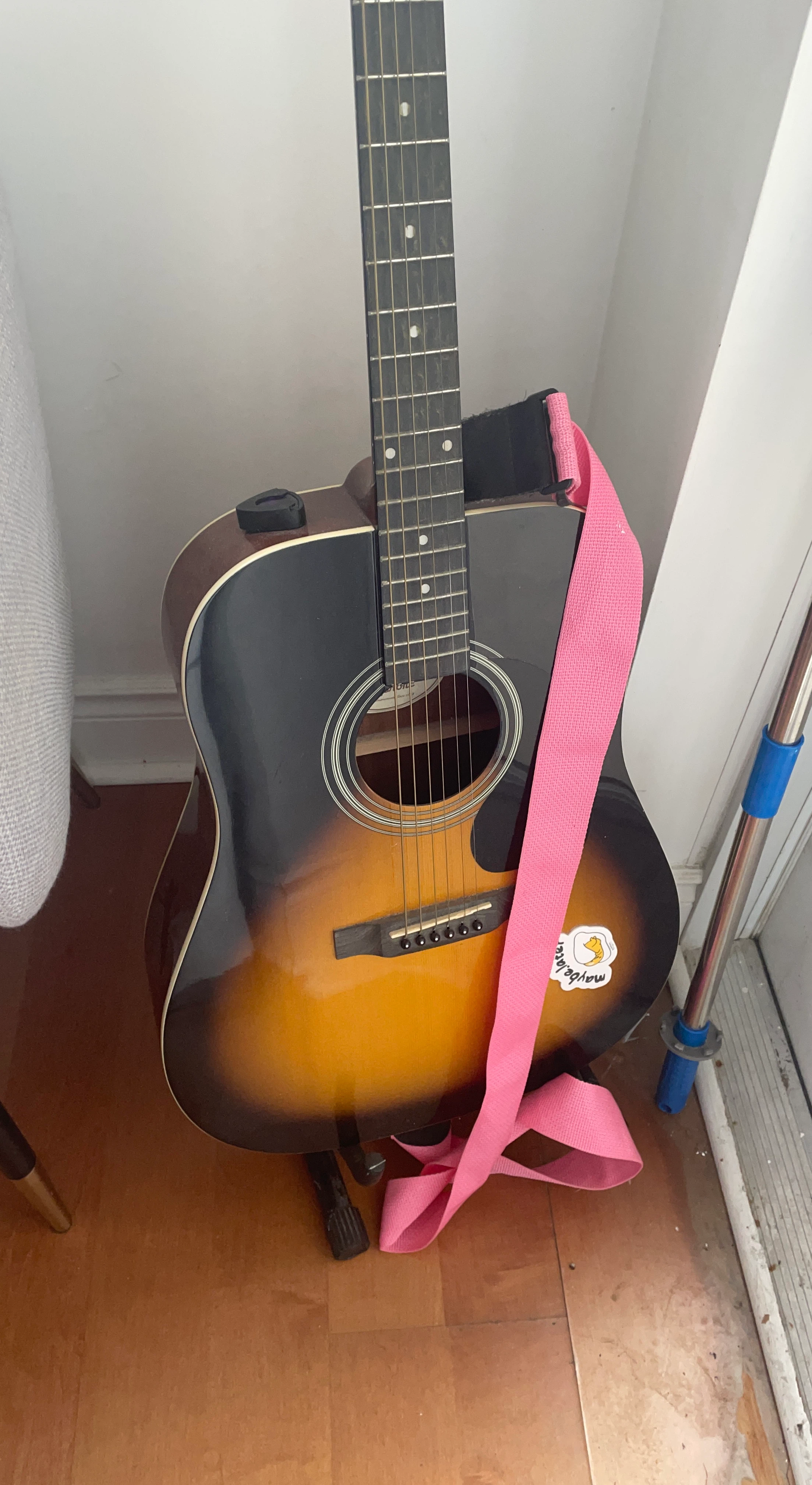 Acoustic Guitar with Pink Strap