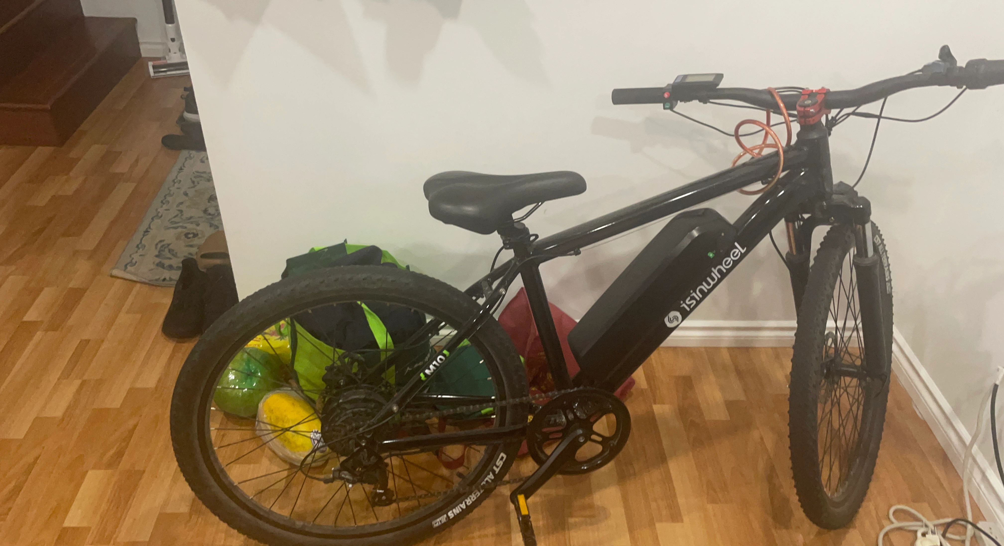 isinwheel M10 Electric Mountain Bike with a spare battery