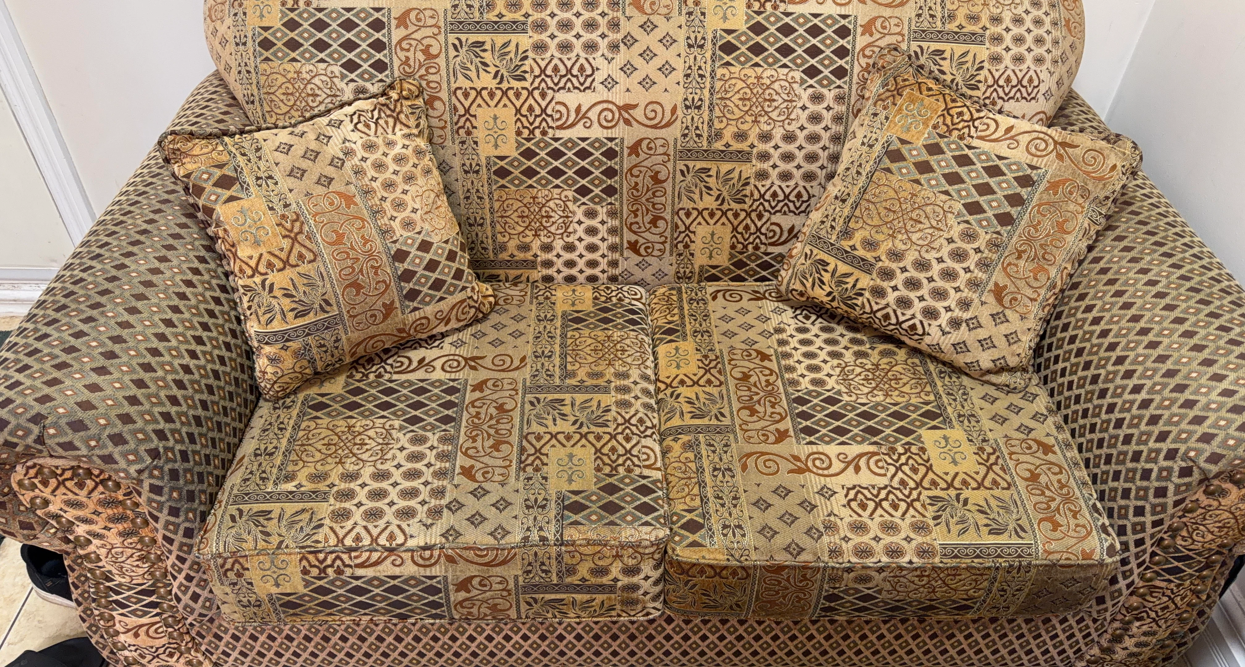 Two-seater sofa with decorative pattern