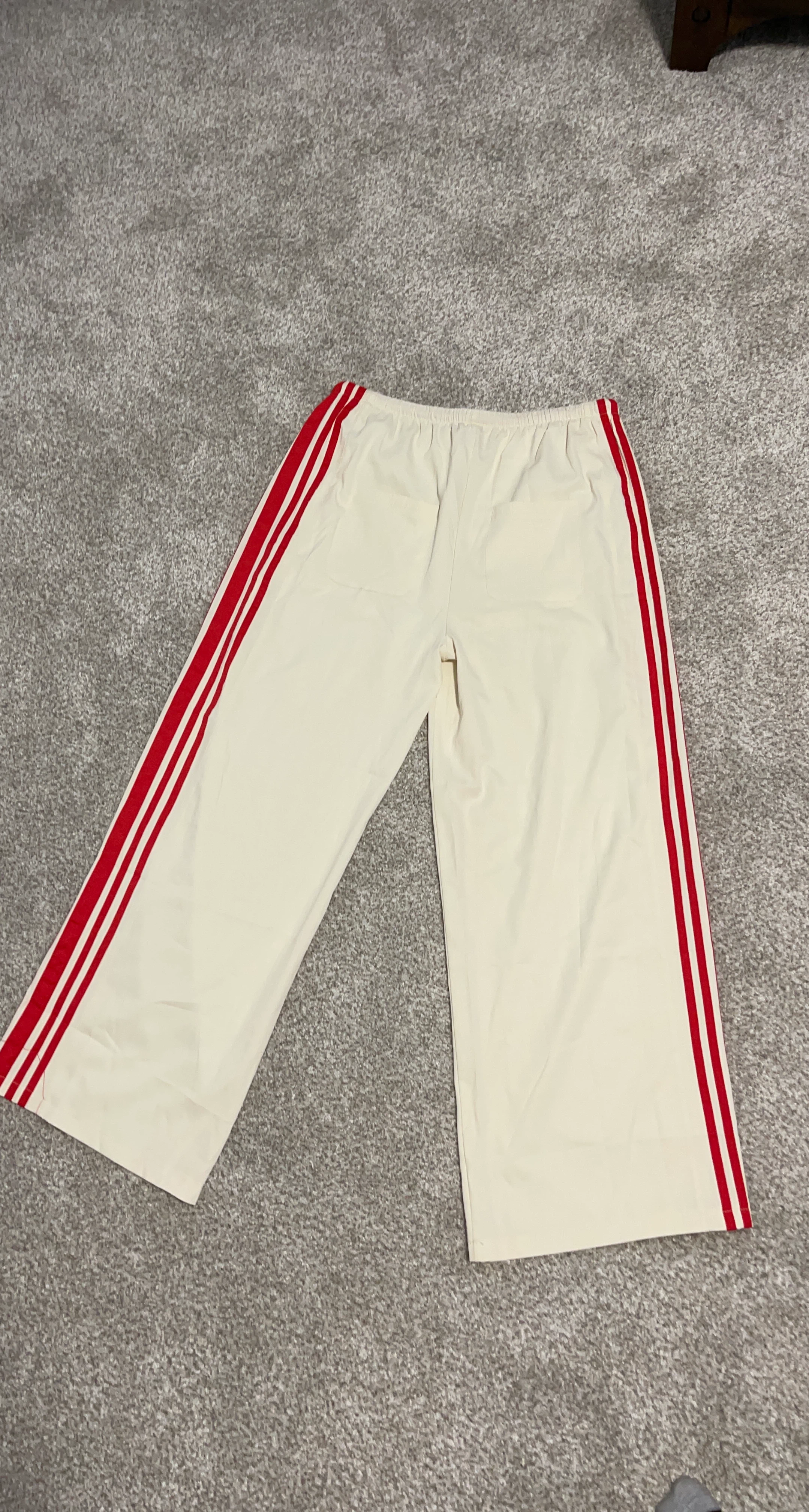 Adidas cream track pants with red stripes