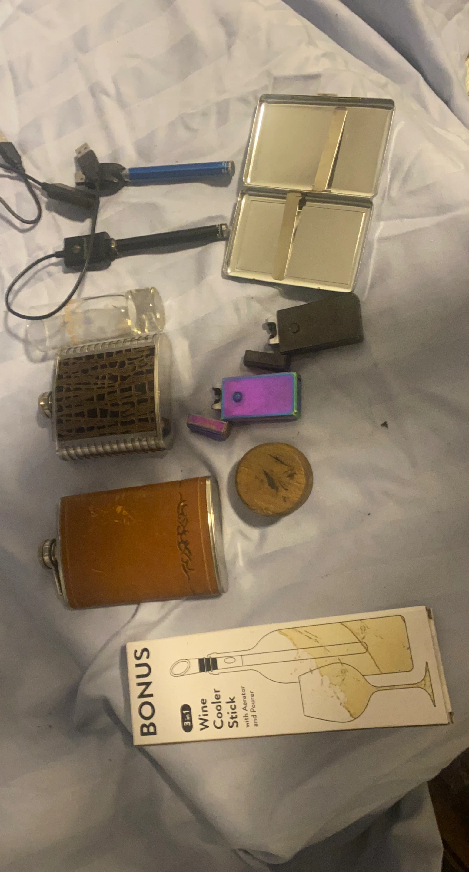 Bundle of Lighters, Flasks, and a Wine Cooler Stick