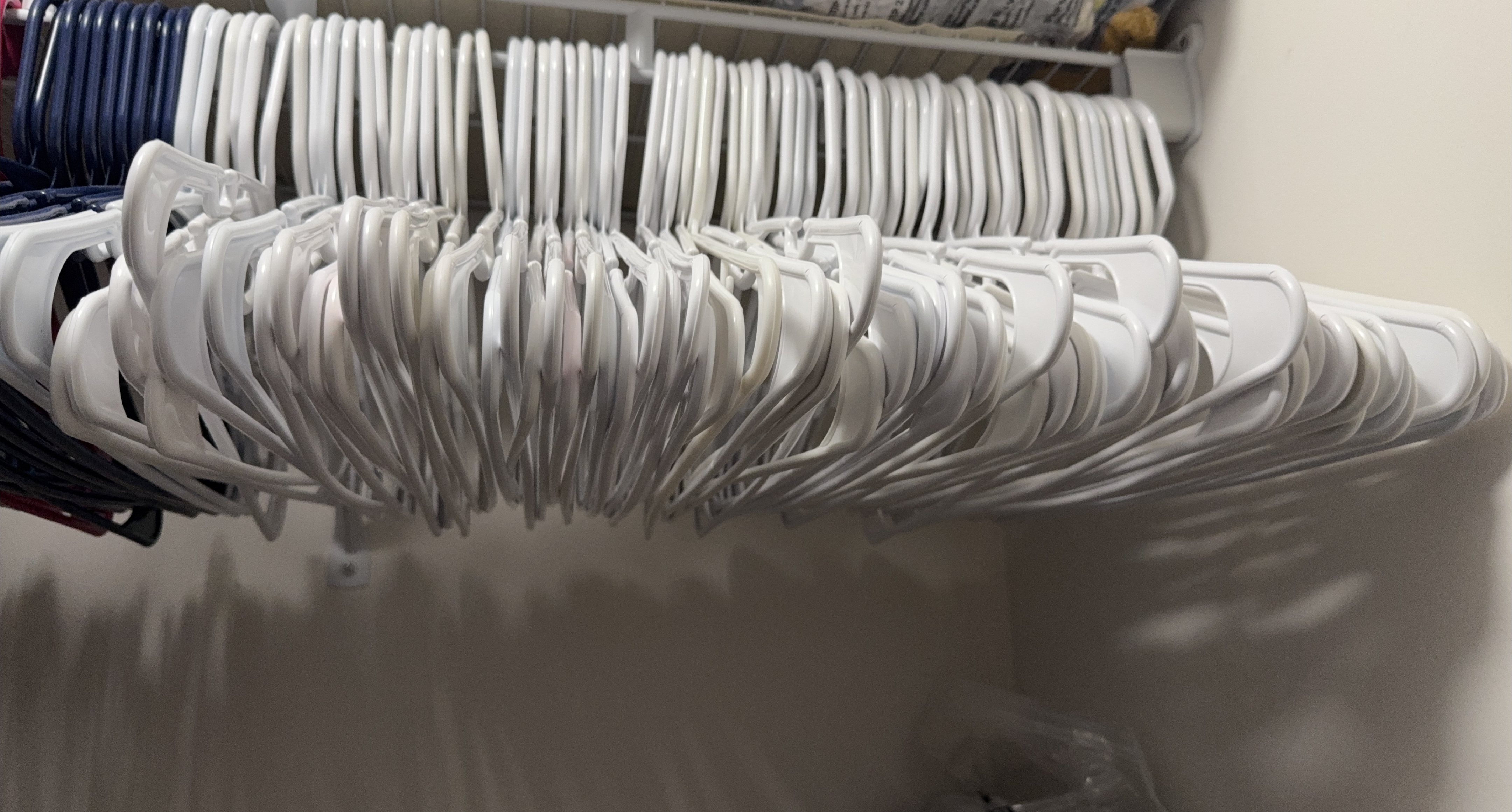 Lot of White Plastic Clothes Hangers
