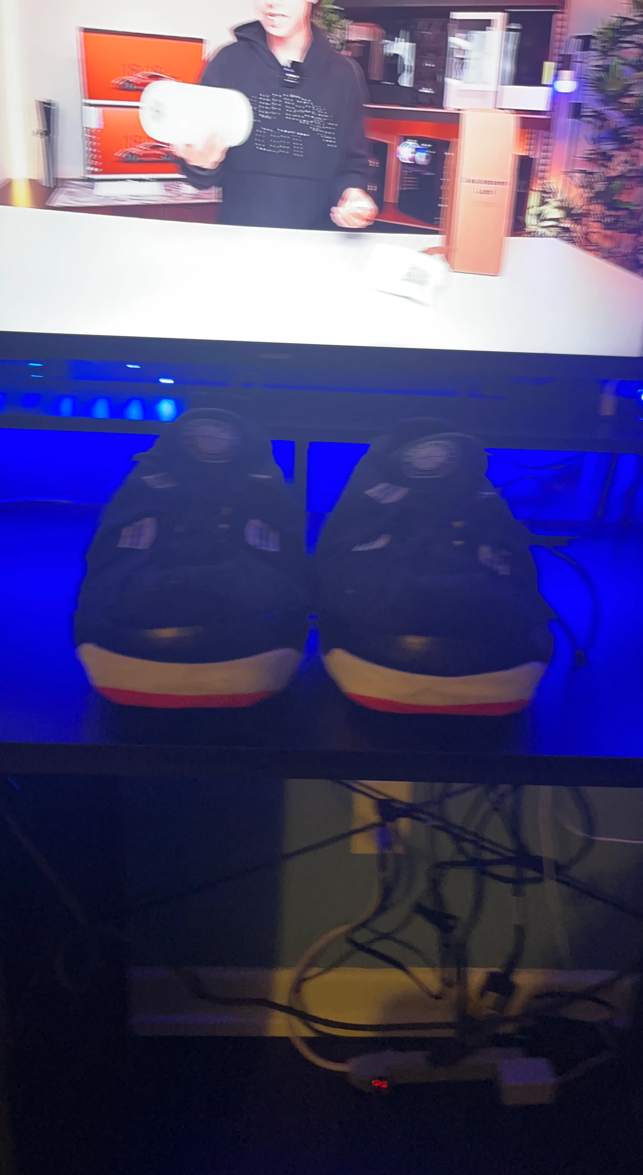 Pair of Black and Red Sneakers