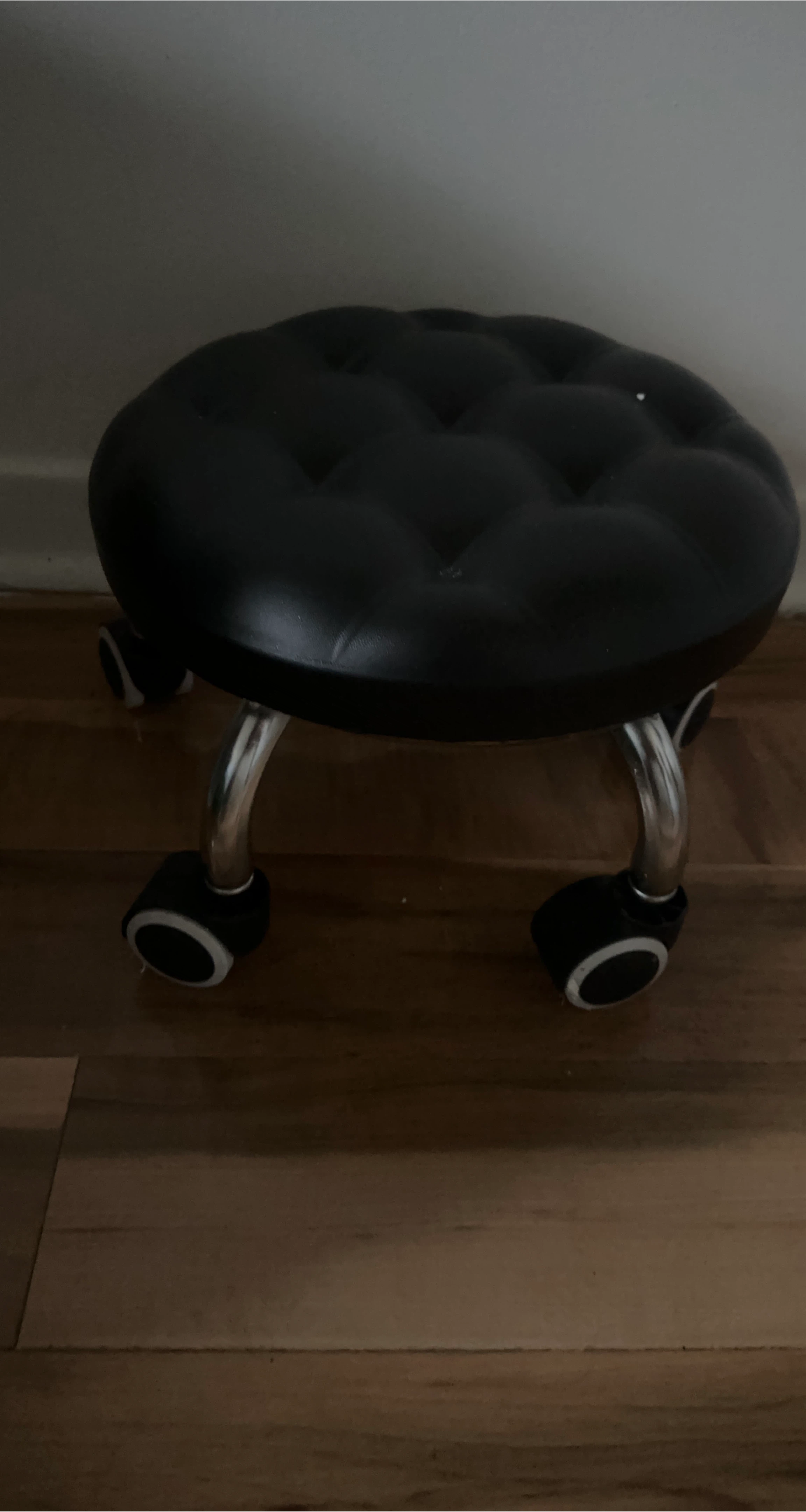 Black Upholstered Rolling Stool