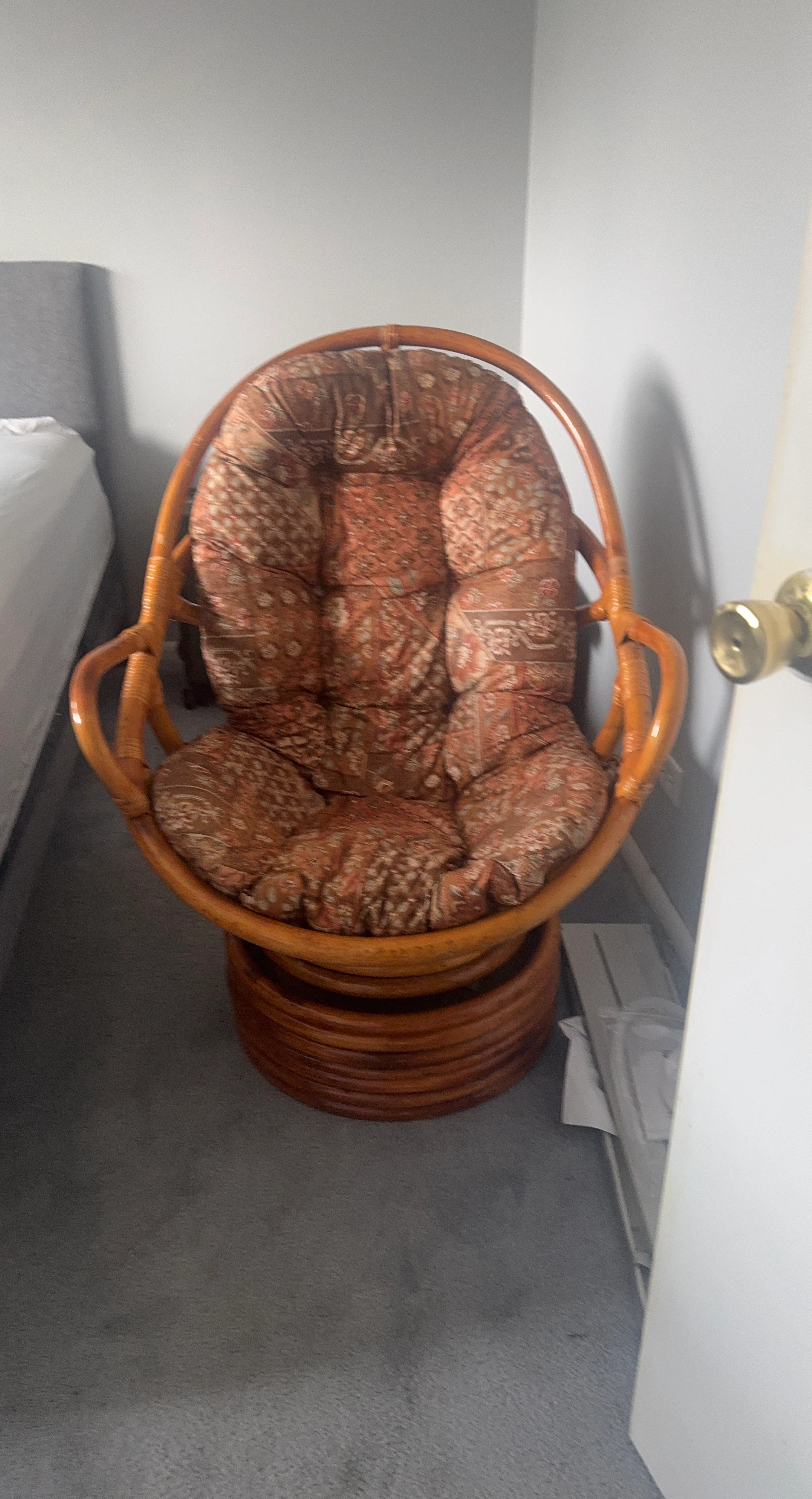 Rattan Swivel Chair with Floral Cushions