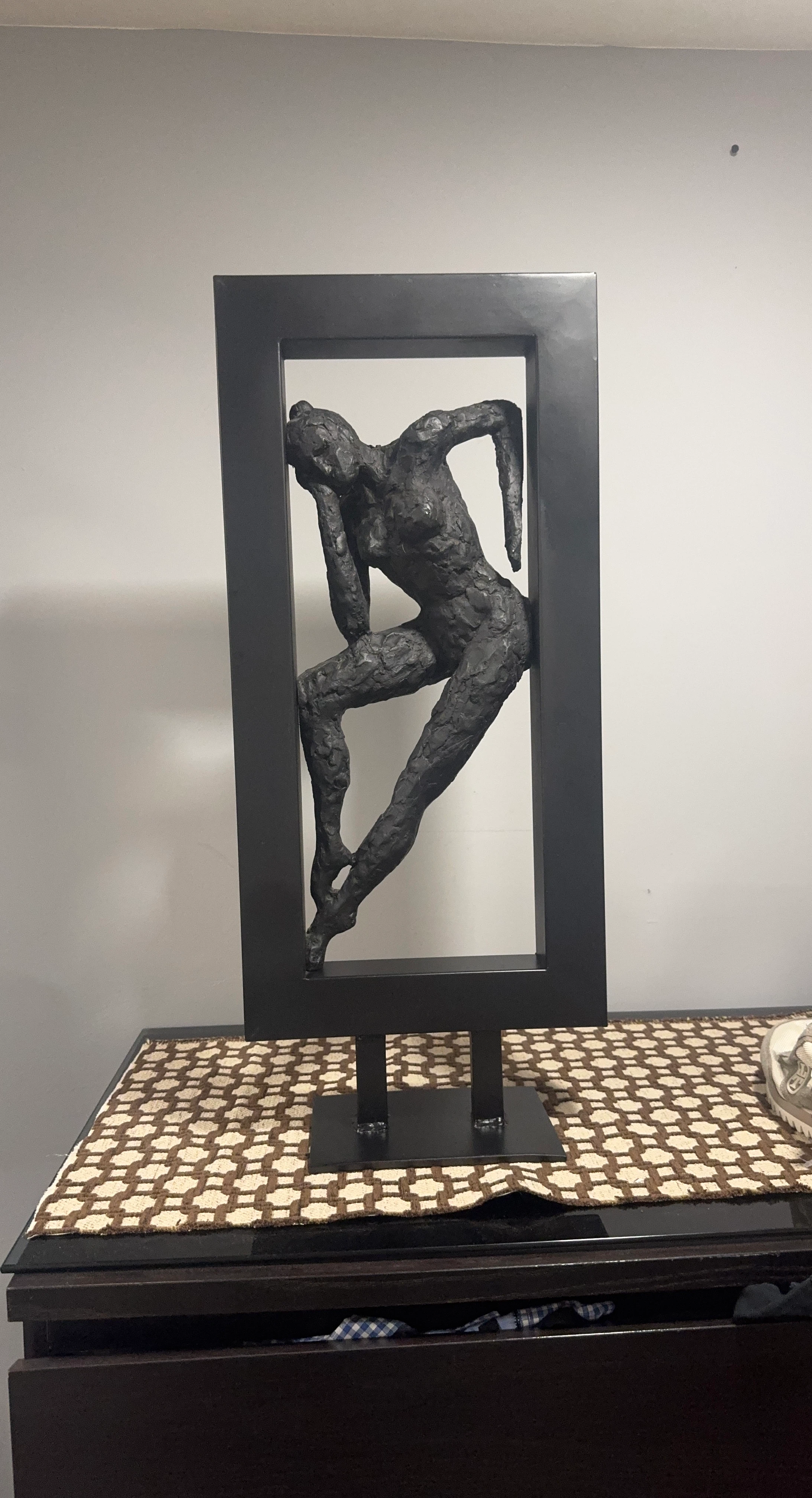Sculpture of a person in a frame