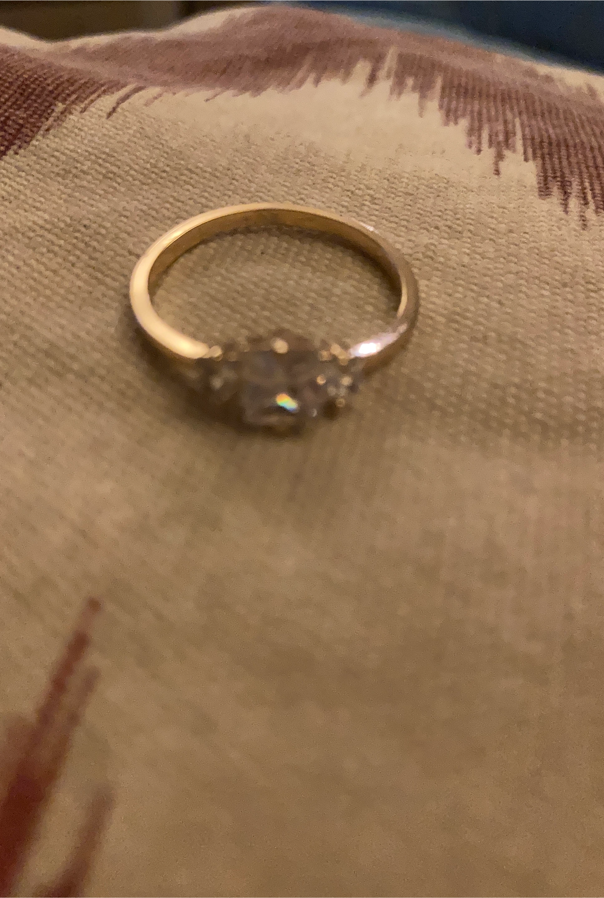 Gold engagement ring with accent stones