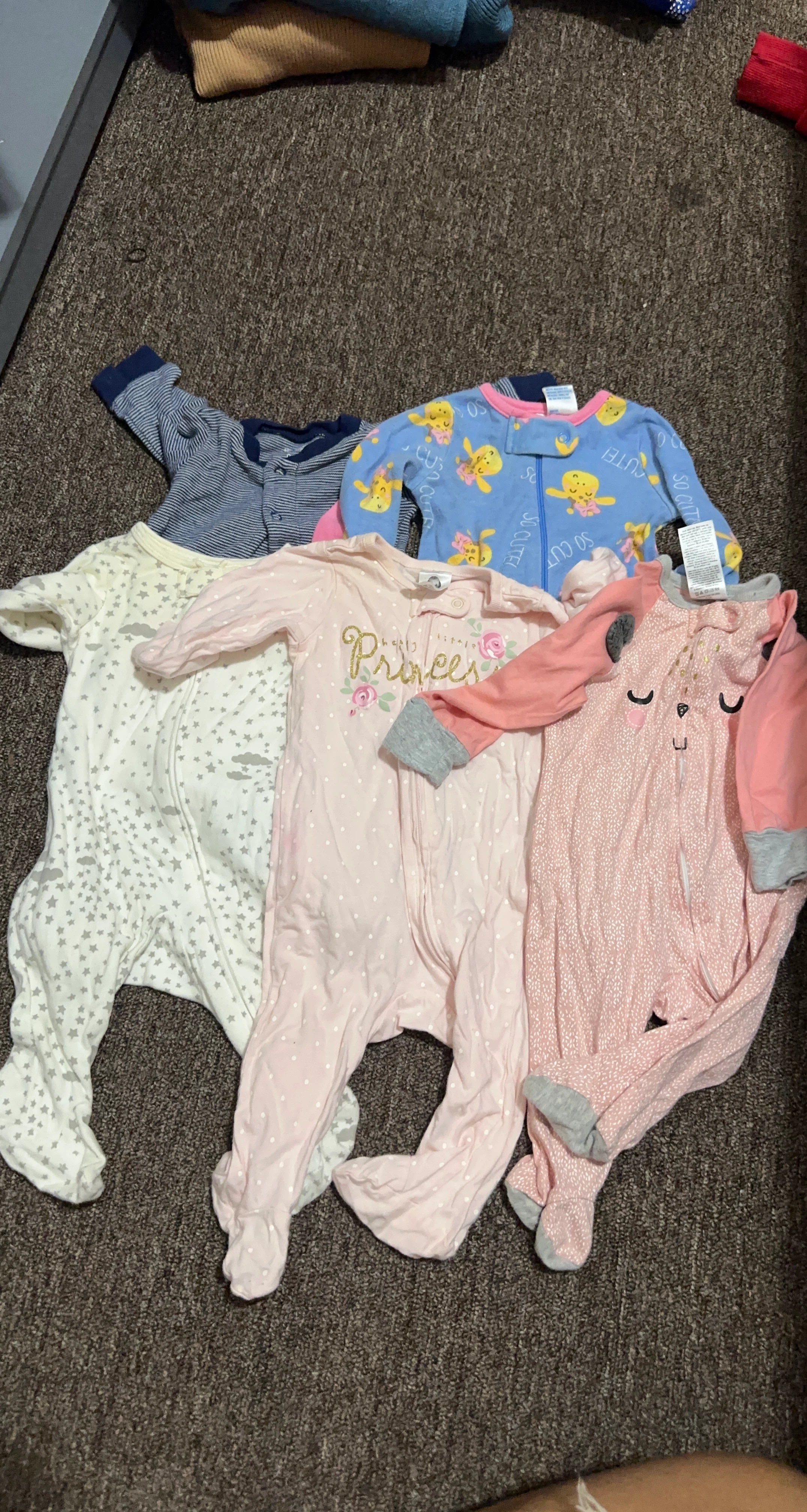 Bundle of baby onesies
