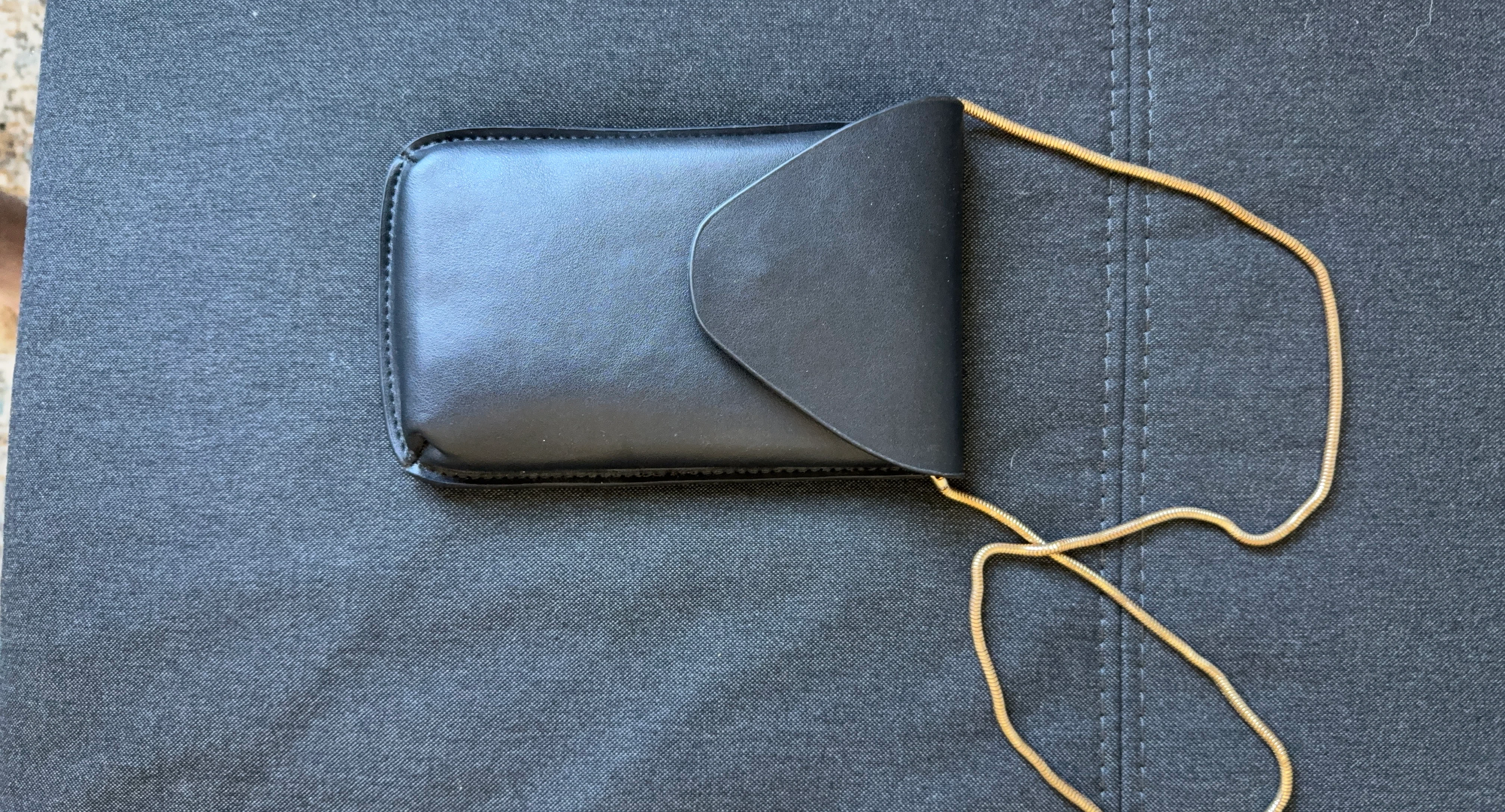 Black faux leather glasses case with gold chain
