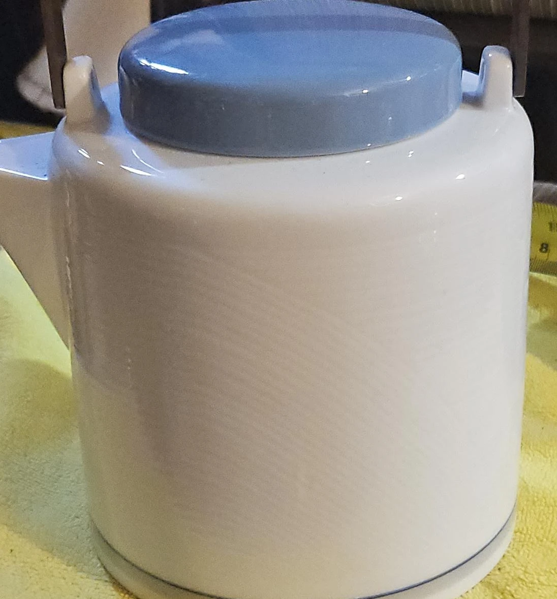 White Ceramic Teapot with Blue Lid and Metal Handle