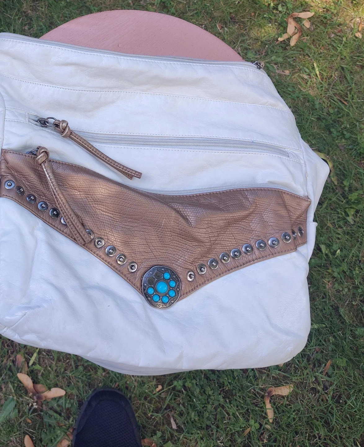 White and brown hobo bag with turquoise detail