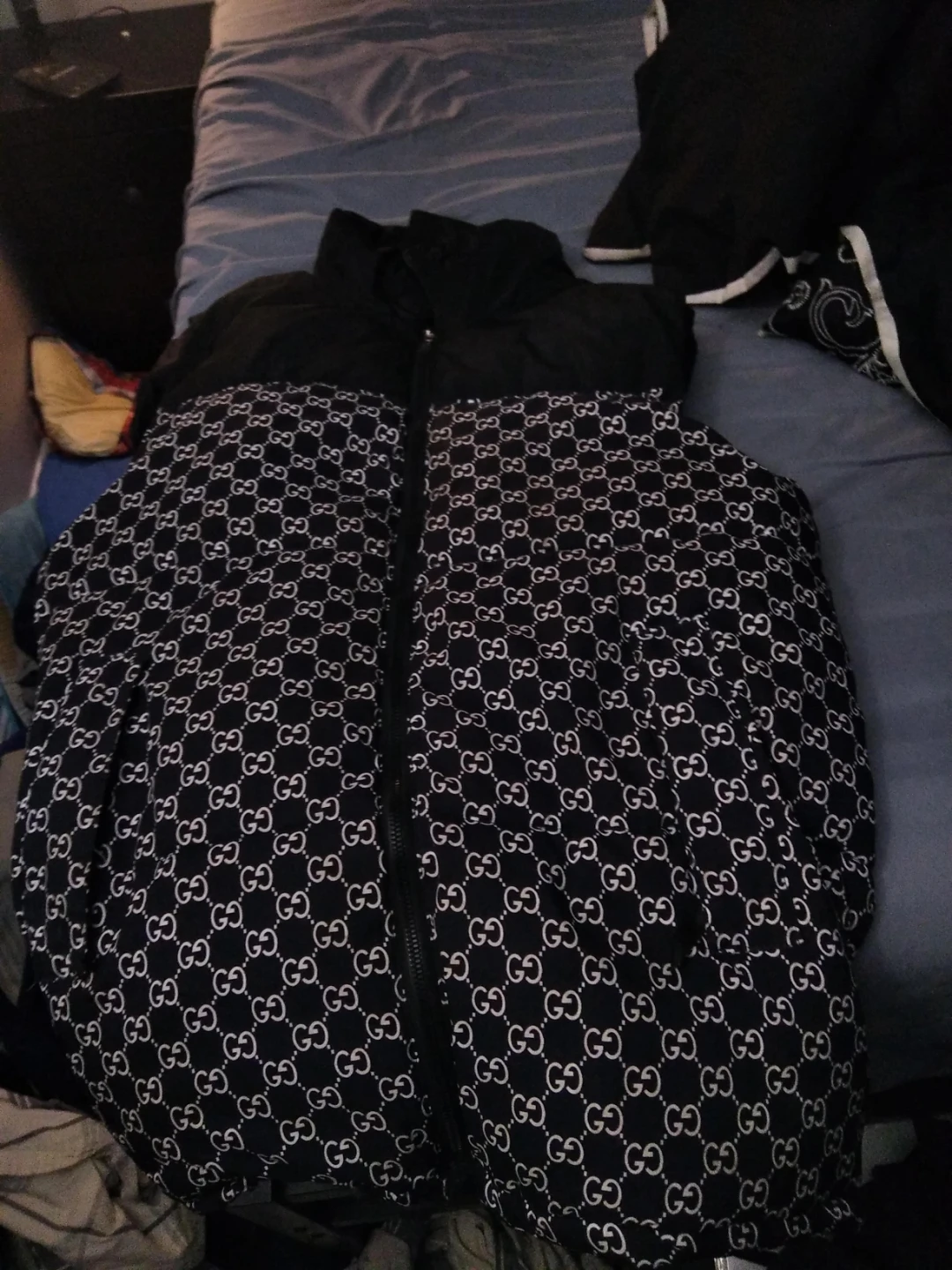 Black puffer jacket with GG pattern