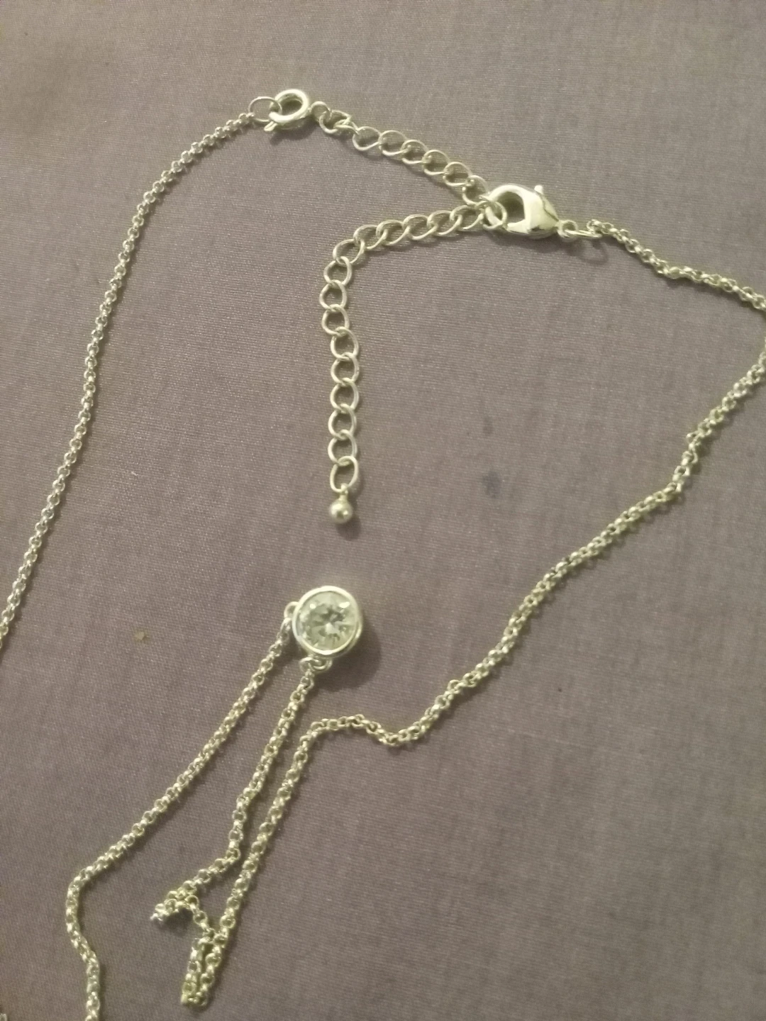 Silver-tone necklace with clear stone
