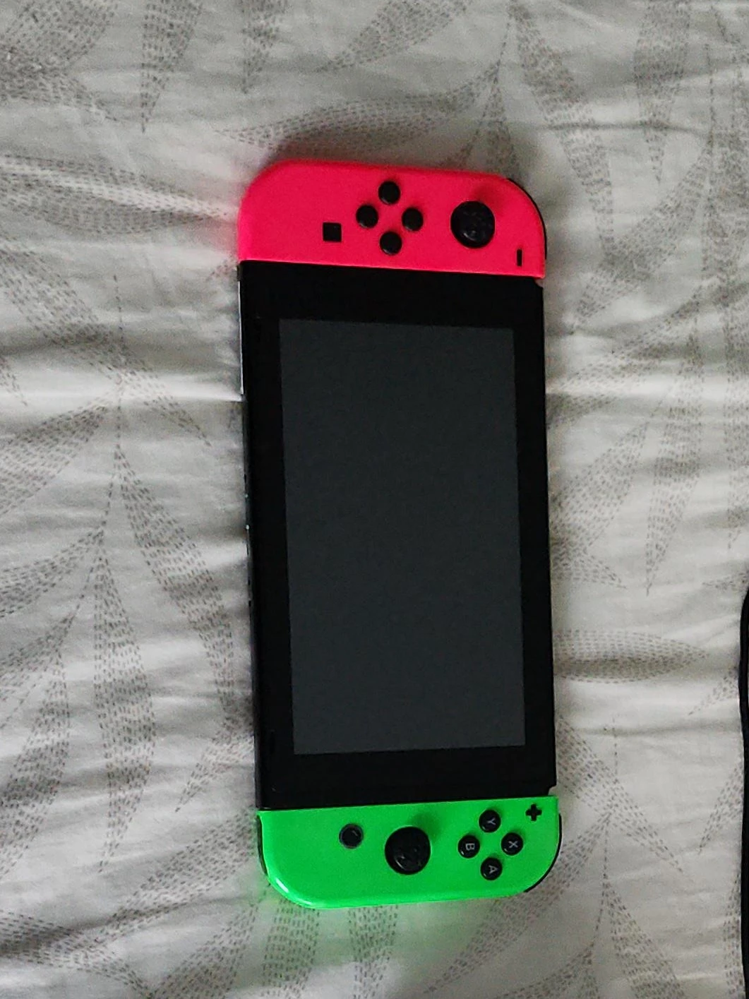Nintendo Switch console with neon Joy-Cons